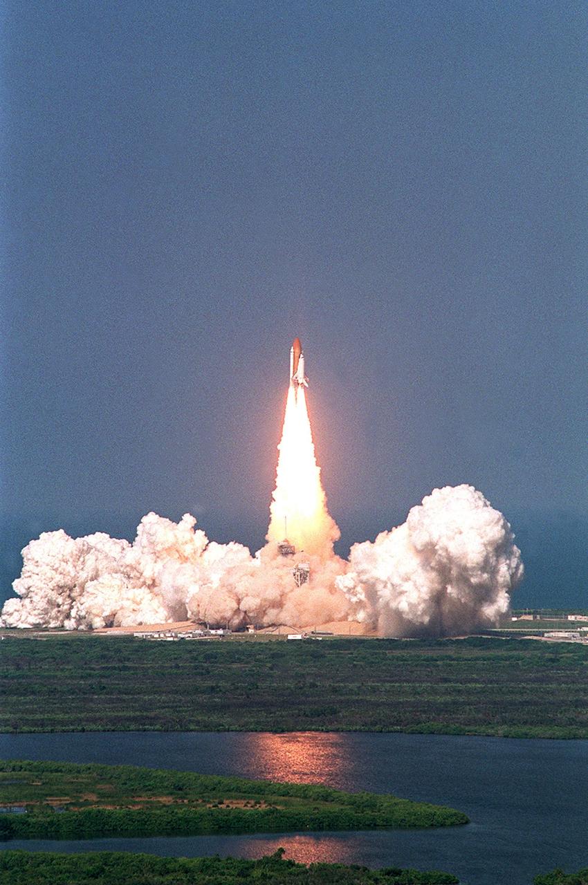 KENNEDY SPACE CENTER, FLA. - Space Shuttle Atlantis leaps clear of the billowing steam and smoke on Launch Pad 39B after an on-time liftoff of 3:46 p.m. EDT on mission STS-112. Along with a crew of six, Atlantis carries the S1 Integrated Truss Structure and the Crew and Equipment Translation Aid (CETA) Cart A. The CETA is the first of two human-powered carts that will ride along the ISS railway, providing mobile work platforms for future spacewalking astronauts. On the 11-day mission, three spacewalks are planned to attach the S1 truss.