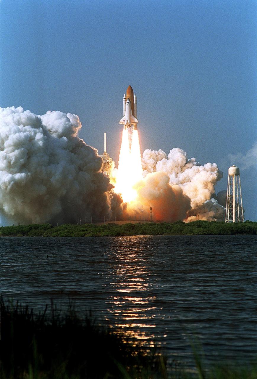 KENNEDY SPACE CENTER, FLA. - Space Shuttle Atlantis leaps from the steam and smoke billowing across Launch Pad 39B after an on-time liftoff of 3:46 p.m. EDT on mission STS-112. Along with a crew of six, Atlantis carries the S1 Integrated Truss Structure and the Crew and Equipment Translation Aid (CETA) Cart A. The CETA is the first of two human-powered carts that will ride along the ISS railway, providing mobile work platforms for future spacewalking astronauts. On the 11-day mission, three spacewalks are planned to attach the S1 truss.