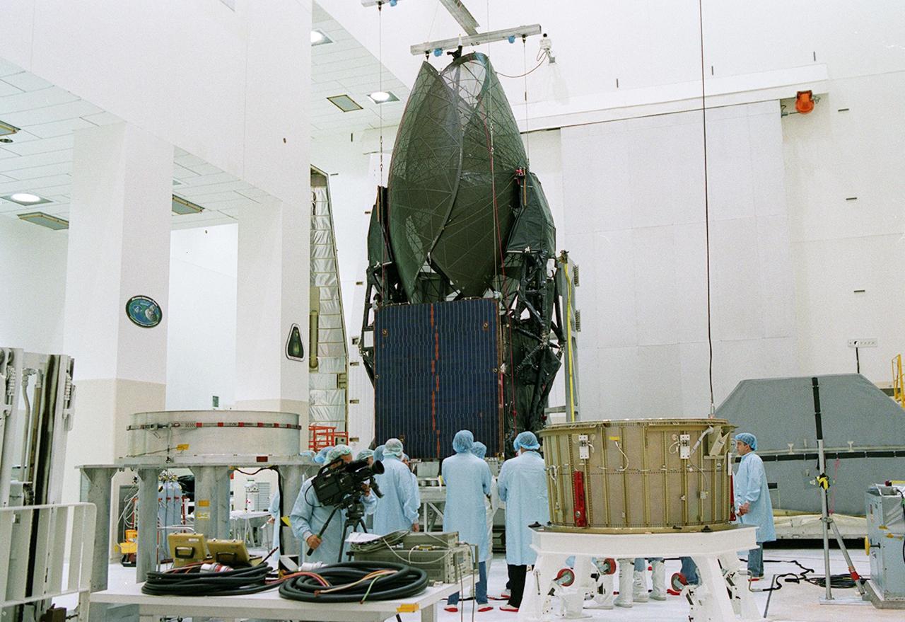 KENNEDY SPACE CENTER, FLA. -- The TDRS-J spacecraft is unpacked and prepared to be moved to a workstand in the Spacecraft Assembly and Encapsulation Facility-2 (SAEF-2) for final checkout and processing before launch, currently targeted for Nov. 20. TDRS-J is the third in the current series of three Tracking and Data Relay Satellites designed to replenish the existing on-orbit fleet of six spacecraft, the first of which was launched in 1983. The Tracking and Data Relay Satellite System is the primary source of space-to-ground voice, data and telemetry for the Space Shuttle. It also provides communications with the International Space Station and scientific spacecraft in low-earth orbit, such as the Hubble Space Telescope, and launch support for some expendable vehicles. This new advanced series of satellites will extend the availability of TDRS communications services until approximately 2017. 