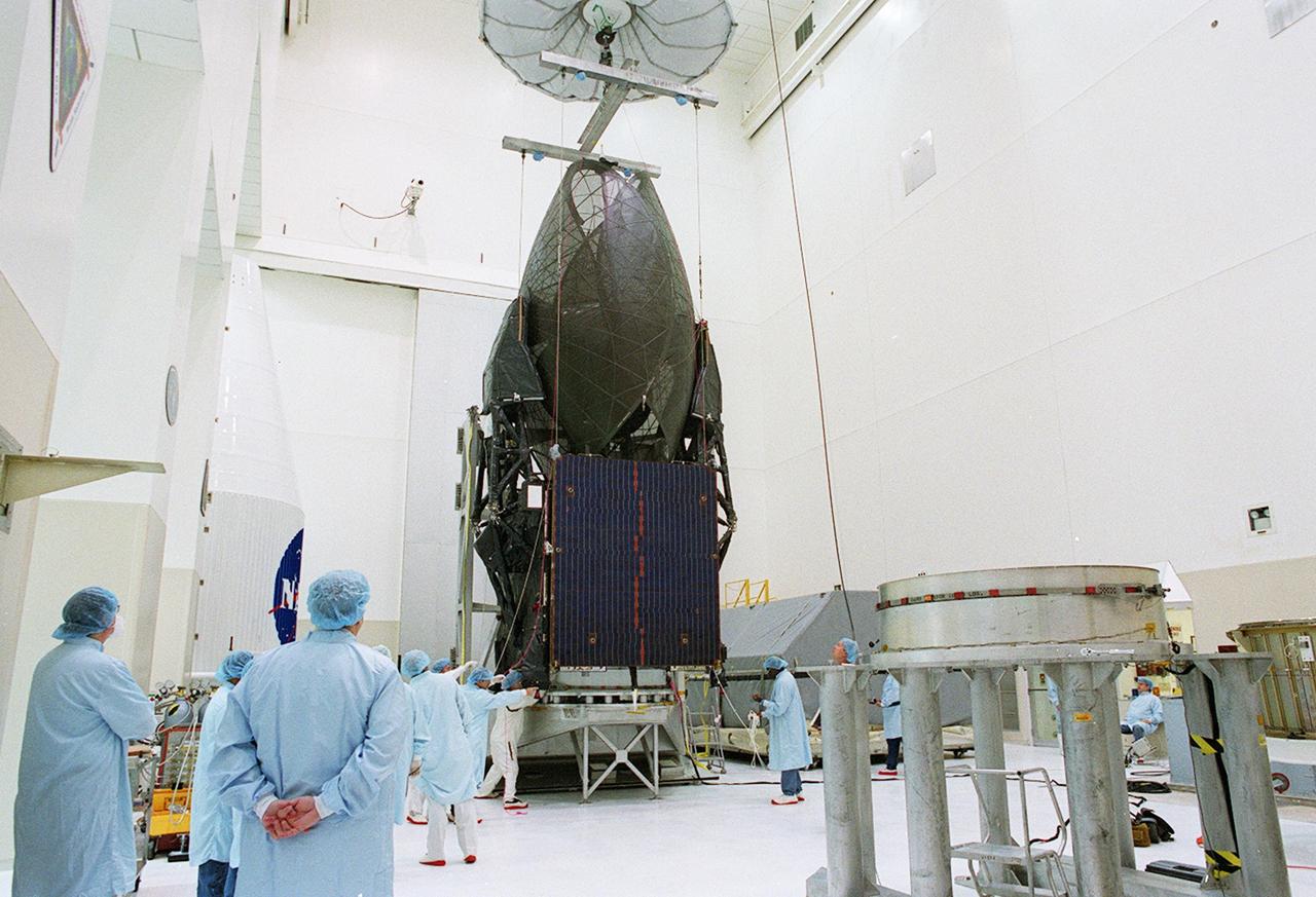 KENNEDY SPACE CENTER, FLA. -- Workers prepare to lift the TDRS-J spacecraft for its move to a workstand in the Spacecraft Assembly and Encapsulation Facility-2 (SAEF-2) for final checkout and processing before launch, currently targeted for Nov. 20. TDRS-J is the third in the current series of three Tracking and Data Relay Satellites designed to replenish the existing on-orbit fleet of six spacecraft, the first of which was launched in 1983. The Tracking and Data Relay Satellite System is the primary source of space-to-ground voice, data and telemetry for the Space Shuttle. It also provides communications with the International Space Station and scientific spacecraft in low-earth orbit, such as the Hubble Space Telescope, and launch support for some expendable vehicles. This new advanced series of satellites will extend the availability of TDRS communications services until approximately 2017. 