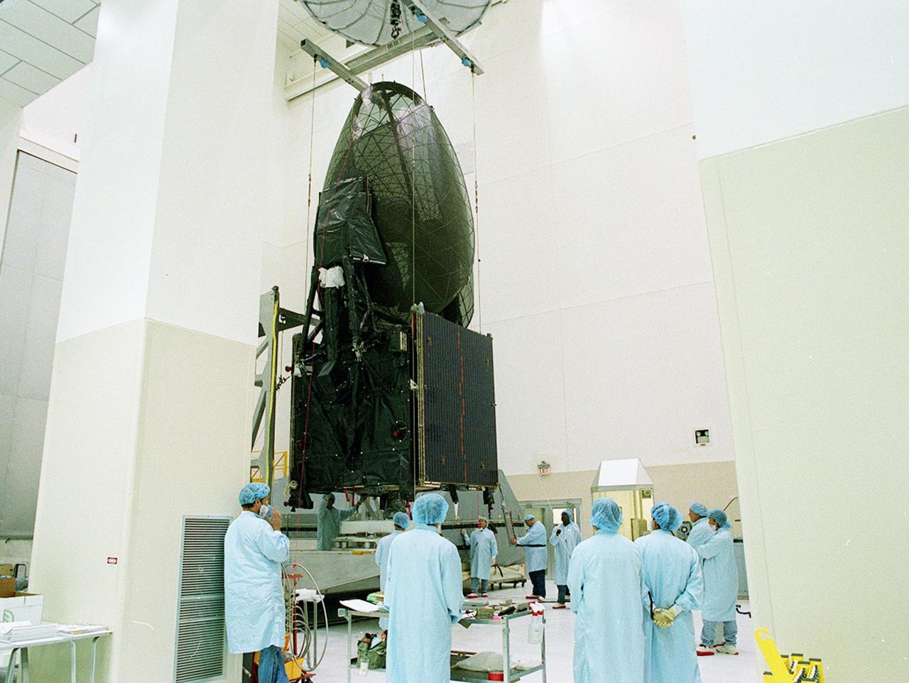 KENNEDY SPACE CENTER, FLA. -- Workers lift the TDRS-J spacecraft for its move to a workstand in the Spacecraft Assembly and Encapsulation Facility-2 (SAEF-2) for final checkout and processing before launch, currently targeted for Nov. 20. TDRS-J is the third in the current series of three Tracking and Data Relay Satellites designed to replenish the existing on-orbit fleet of six spacecraft, the first of which was launched in 1983. The Tracking and Data Relay Satellite System is the primary source of space-to-ground voice, data and telemetry for the Space Shuttle. It also provides communications with the International Space Station and scientific spacecraft in low-earth orbit, such as the Hubble Space Telescope, and launch support for some expendable vehicles. This new advanced series of satellites will extend the availability of TDRS communications services until approximately 2017. 