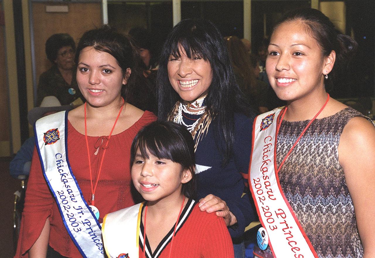 KENNEDY SPACE CENTER, FLA. -- Chickasaw Indian princesses pose with folk singer Buffy Saint- Marie (center) during a Native American ceremony held in the Rocket Garden in the KSC Visitor Complex.  Several days of activities were held at KSC and in  Orlando commemorating John B. Herrington as the first tribally enrolled Native American astronaut to fly on a Shuttle mission. Herrington is a Mission Specialist on STS-113.      