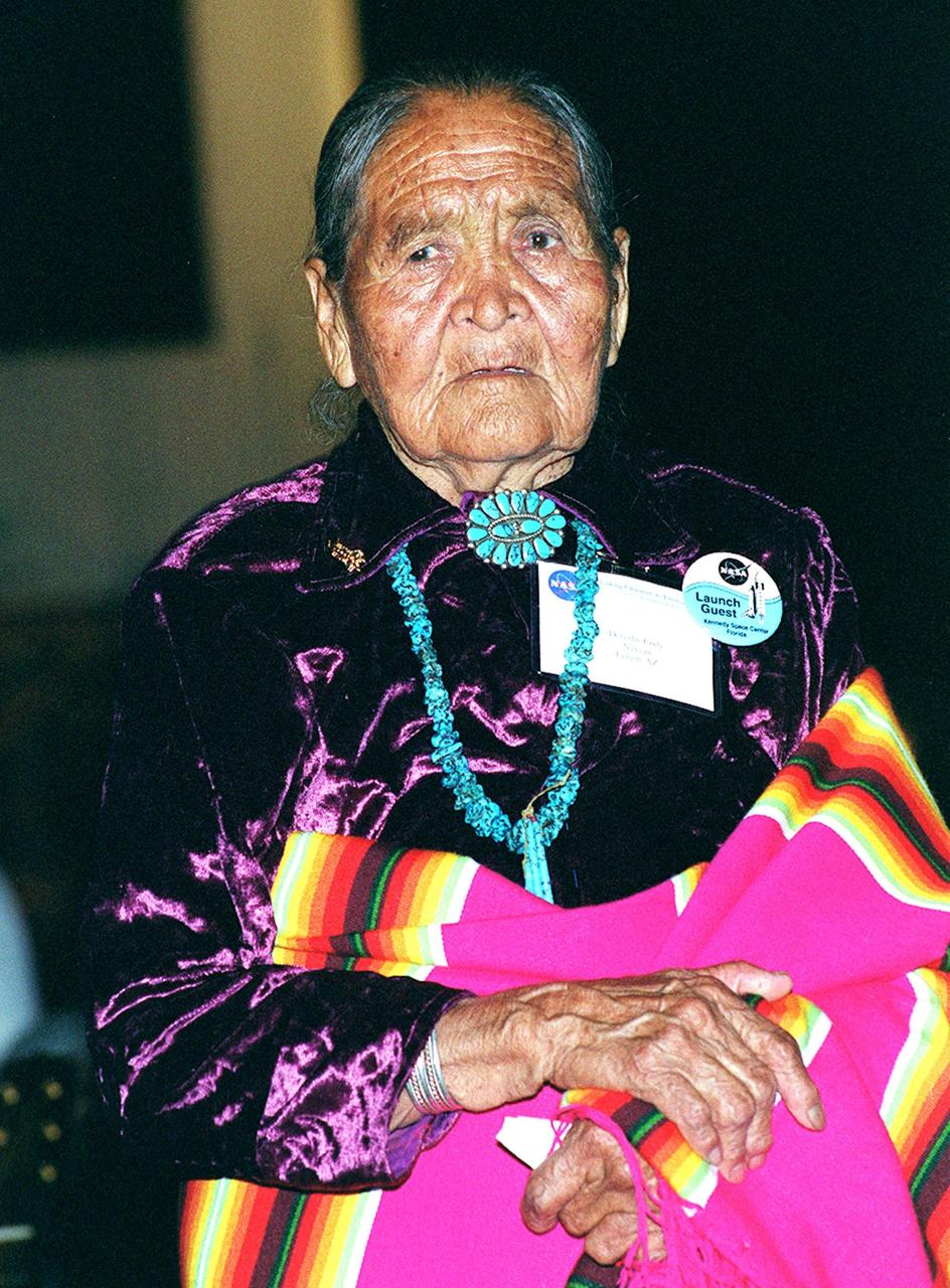 KENNEDY SPACE CENTER, FLA. - An elder of her Navaho tribe, Dorothy Cody shares the stage with her granddaughter Radmilla Cody (not shown), the 2001 Miss Navaho Nation, who is singing the "Star Spangled Banner" in her native language during a pre-launch Native American ceremony. The ceremony was part of several days' activities commemorating John B. Herrington as the first tribally enrolled Native American astronaut to fly on a Shuttle mission. Herrington is a Mission Specialist on STS-113.