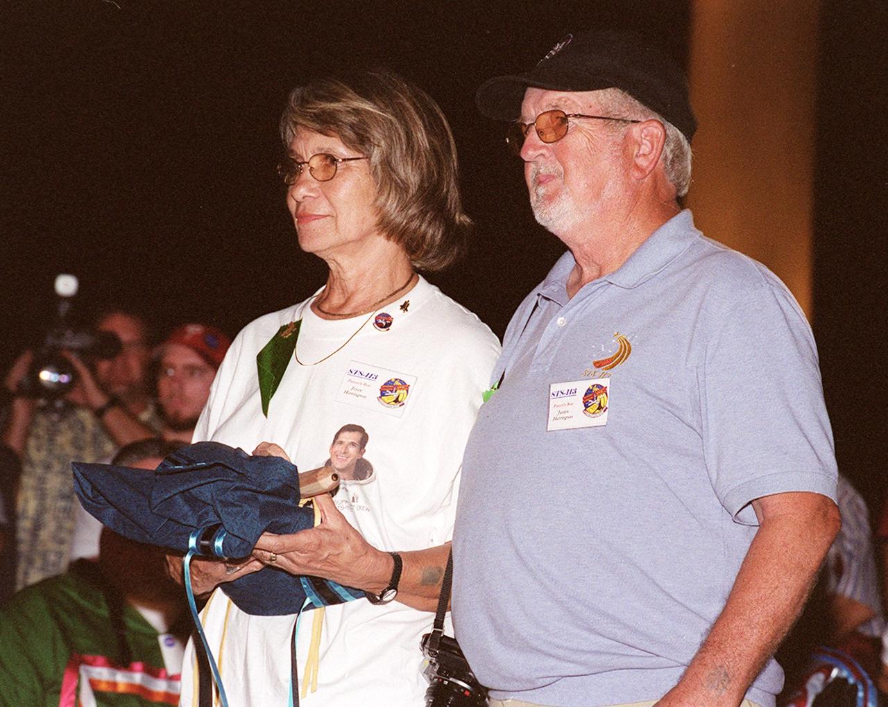 KENNEDY SPACE CENTER, FLA. --  Joyce and James Herrington, parents of John Herrington, accept a gift during a pre-launch Native American ceremony.  They are the parents of John Herrington, mission specialist on mission STS-113.  Herrington is the first Native American to be going into space.