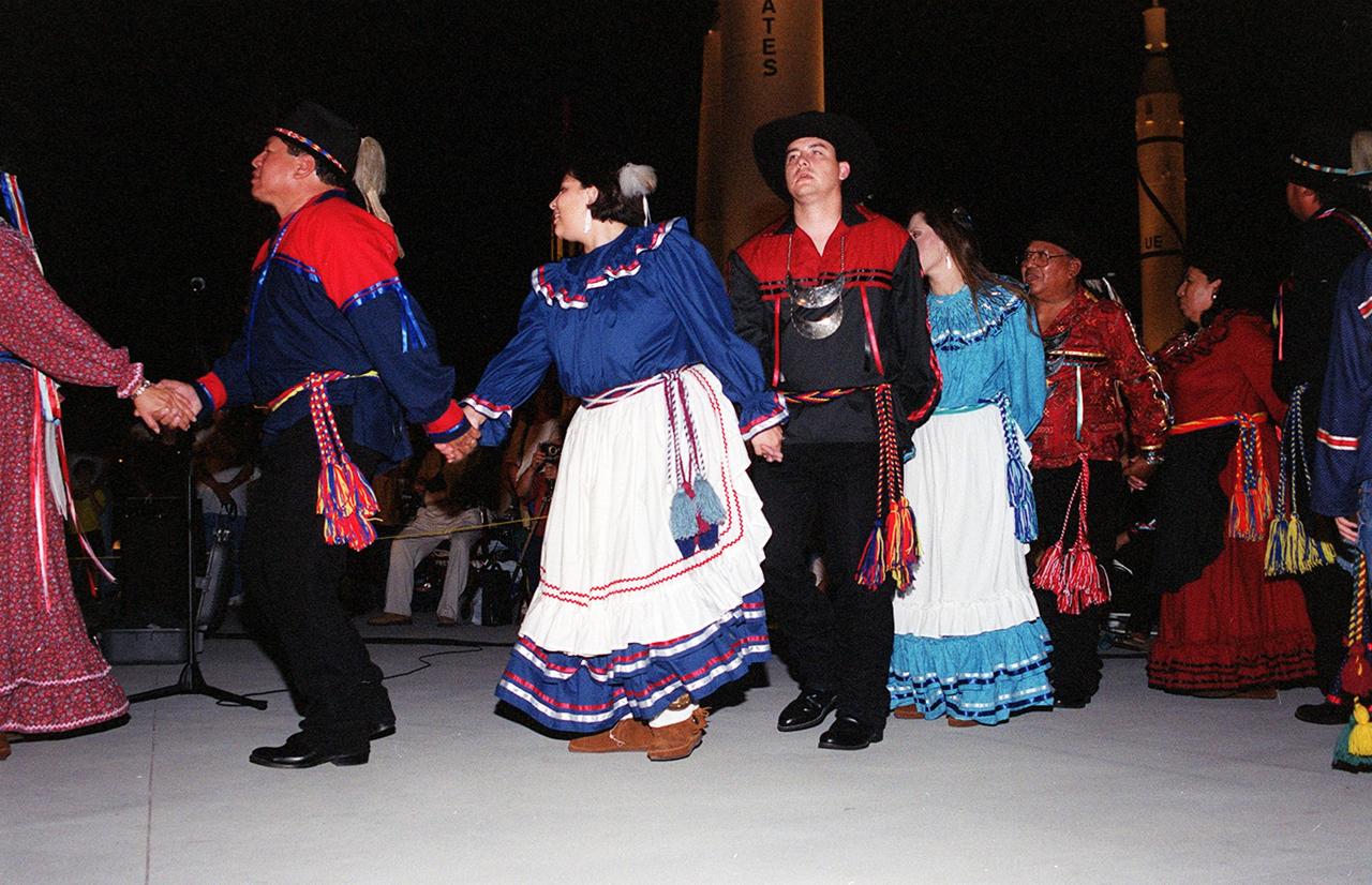 KENNEDY SPACE CENTER, FLA. -- The Chickasaw Dance Troupe performs an Honor Dance for John Herrington's parents during the Native American Ceremony at the Rocket Garden in the KSC Visitor Complex. The ceremony was part of several days' activities commemorating John B. Herrington as the first tribally enrolled Native American astronaut to fly on a Shuttle mission. Herrington is a Mission Specialist on STS-113.