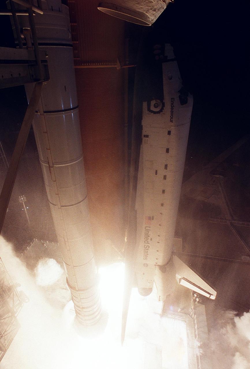 KENNEDY SPACE CENTER, FLA. - From a blaze of fire and smoke, Space Shuttle Endeavour roars off the launch pad on mission STS-113. Liftoff from Launch Pad 39A occurred ontime at 7:49:47 p.m. EST.  The launch is the 19th for Endeavour, and the 112th flight in the Shuttle program.  Mission STS-113 is the 16th assembly flight to the International Space Station, carrying another structure for the Station, the P1 integrated truss.  Also onboard are the Expedition 6 crew, who will replace Expedition 5.  Endeavour is scheduled to land at KSC after an 11-day journey.            