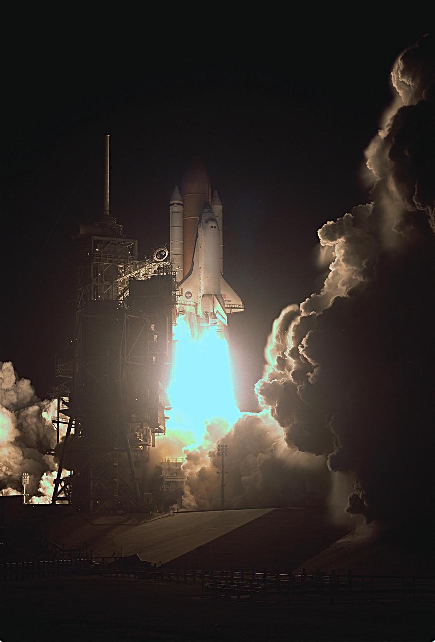 KENNEDY SPACE CENTER, FLA. - Launch Pad 39A is illuminated as Space Shuttle Endeavour blazes into the sky on mission STS-113. Liftoff from Launch Pad 39A occurred ontime at 7:49:47 p.m. EST. The launch is the 19th for Endeavour, and the 112th flight in the Shuttle program. Mission STS-113 is the 16th assembly flight to the International Space Station, carrying another structure for the Station, the P1 integrated truss. Also onboard are the Expedition 6 crew, who will replace Expedition 5. Endeavour is scheduled to land at KSC after an 11-day journey.