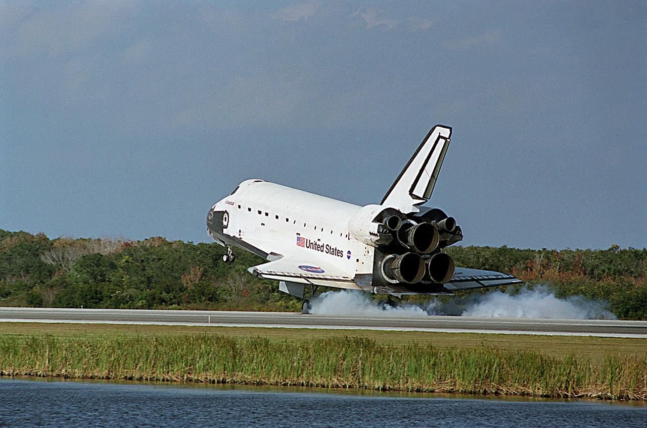 KENNEDY SPACE CENTER, FLA. -- The wheels of Space Shuttle Endeavour make contact with runway 33 at the Shuttle Landing Facility after completing the 13-day, 18-hour, 48-minute, 5.74-million mile STS-113 mission to the International Space Station. Main gear touchdown was at 2:37:12 p.m. EST, nose gear touchdown was at 2:37:23 p.m., and wheel stop was at 2:38:25 p.m. Poor weather conditions thwarted landing opportunities until a fourth day, the first time in Shuttle program history that a landing has been waved off for three consecutive days. The vehicle carries the STS-113 crew, Commander James Wetherbee, Pilot Paul Lockhart and Mission Specialists Michael Lopez-Alegria and John Herrington, as well as the returning Expedition Five crew, Commander Valeri Korzun, ISS Science Officer Peggy Whitson and Flight Engineer Sergei Treschev. The installation of the P1 truss on the International Space Station was accomplished during the mission.
