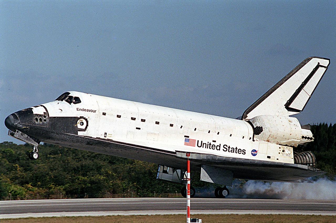 KENNEDY SPACE CENTER, FLA. -- The wheels of Space Shuttle Endeavour make contact with runway 33 at the Shuttle Landing Facility, bringing to a close the 13-day, 18-hour, 48-minute, 5.74-million mile STS-113 mission to the International Space Station. Main gear touchdown was at 2:37:12 p.m. EST, nose gear touchdown was at 2:37:23 p.m., and wheel stop was at 2:38:25 p.m. Poor weather conditions thwarted landing opportunities until a fourth day, the first time in Shuttle program history that a landing has been waved off for three consecutive days. The vehicle carries the STS-113 crew, Commander James Wetherbee, Pilot Paul Lockhart and Mission Specialists Michael Lopez-Alegria and John Herrington, as well as the returning Expedition Five crew, Commander Valeri Korzun, ISS Science Officer Peggy Whitson and Flight Engineer Sergei Treschev. The installation of the P1 truss on the International Space Station was accomplished during the mission.