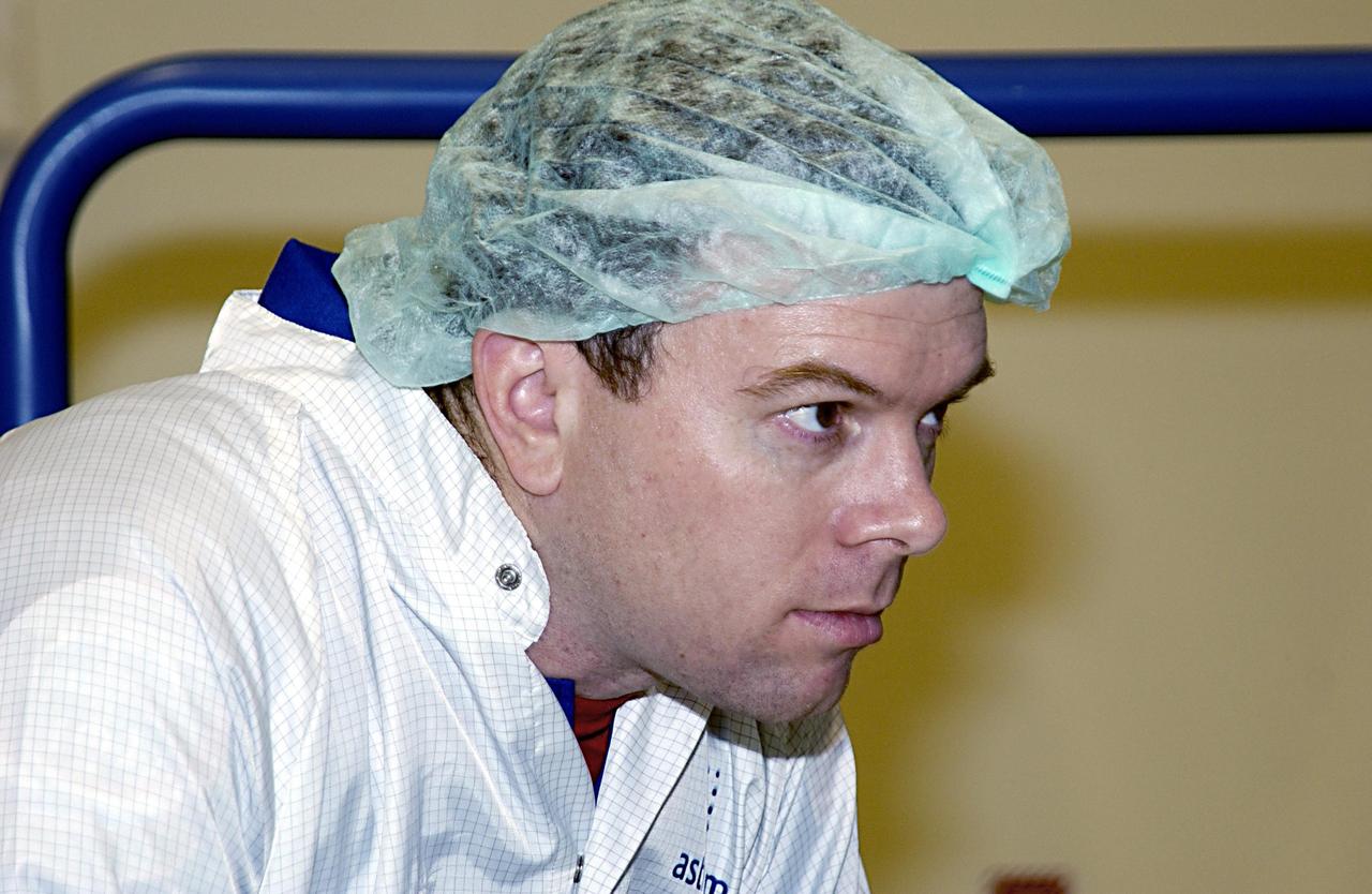 KENNEDY SPACE CENTER, FLA. - At the SPACEHAB facility in Cape Canaveral, STS-114 Pilot James M. Kelly (Lt. Col., USAF)monitors familiarization activities with the hardware that will fly on the STS-114 mission. STS-114 is a utilization and logistics flight that will carry Multi-Purpose Logistics Module Raffaello and the External Stowage Platform (ESP-2), as well as the Expedition 7 crew, to the International Space Station. Launch is targeted for March 1, 2003.