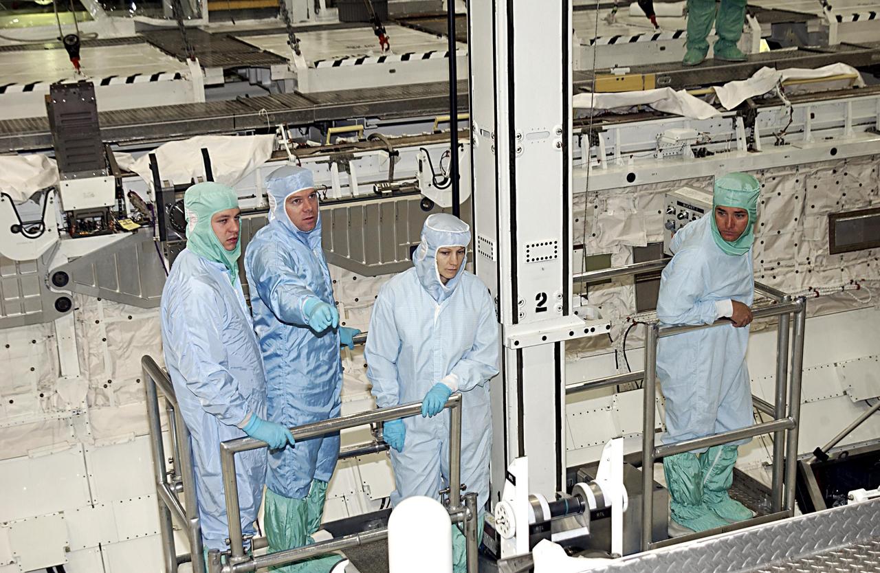 KENNEDY SPACE CENTER, FLA. -- STS-114 crew members check out the hardware in Atlantis that will fly on the STS-114 mission. STS-114 is a utilization and logistics flight (ULF-1) that will carry Multi-Purpose Logistics Module Raffaello and the External Stowage Platform (ESP-2), as well as the Expedition 7 crew, to the International Space Station. Launch is targeted for March 1, 2003.