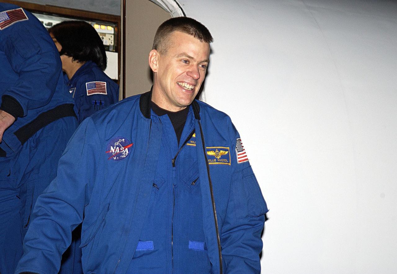 KENNEDY SPACE CENTER, FLA. - STS-107 Pilot William "Willie" McCool smiles at spectators as he arrives at KSC for pre-launch preparations. STS-107 is a mission devoted to research and will include more than 80 experiments that will study Earth and space science, advanced technology development, and astronaut health and safety. The payload on Space Shuttle Columbia includes FREESTAR (Fast Reaction Experiments Enabling Science, Technology, Applications and Research) and the SHI Research Double Module (SHI/RDM), known as SPACEHAB.  Experiments on the module range from material sciences to life sciences.  The crew includes Payload Specialist Ilan Ramon, the first Israeli astronaut.  Other crew members are Commander Rick Husband, Payload Commander Michael Anderson and Mission Specialists Kalpana Chawla, David Brown and Laurel Clark.  Launch of Columbia is targeted for Jan. 16 between 10 a.m. and 2 p.m.