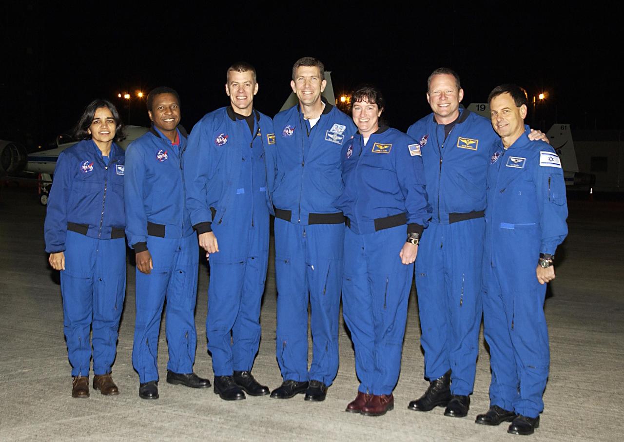 KENNEDY SPACE CENTER, FLA. - The STS-107 crew pose for a photo after their arrival at KSC for pre-launch preparations.  Standing from left to right are Mission Specialist Kalpana Chawla, Payload Commander Michael Anderson, Pilot William "Willie" McCool, Commander Rick Husband, Mission Specialists Laurel Clark and David Brown, and Payload Specialist Ilan Ramon, who is the first Israeli astronaut to fly on a Shuttle mission. STS-107 is a mission devoted to research and will include more than 80 experiments that will study Earth and space science, advanced technology development, and astronaut health and safety. The payload on Space Shuttle Columbia includes FREESTAR (Fast Reaction Experiments Enabling Science, Technology, Applications and Research) and the SHI Research Double Module (SHI/RDM), known as SPACEHAB.  Experiments on the module range from material sciences to life sciences. Launch of Columbia is targeted for Jan. 16 between 10 a.m. and 2 p.m.