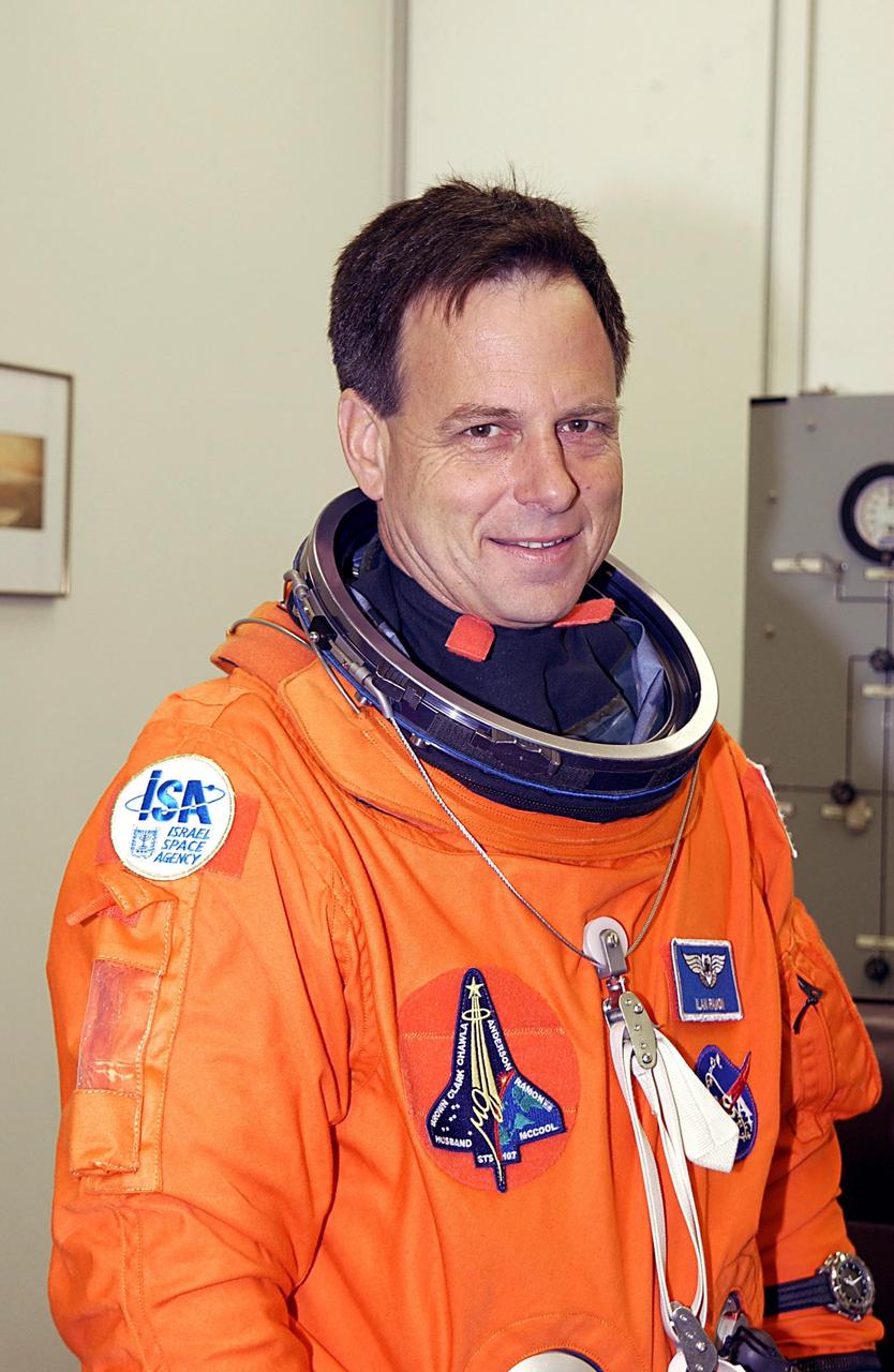 KENNEDY SPACE CENTER, FLA. -- STS-107 Payload Specialist Ilan Ramon, who represents the Israeli Space Agency, suits up for launch. STS-107 is a mission devoted to research and will include more than 80 experiments that will study Earth and space science, advanced technology development, and astronaut health and safety. The payload on Space Shuttle Columbia includes FREESTAR (Fast Reaction Experiments Enabling Science, Technology, Applications and Research) and the SHI Research Double Module (SHI/RDM), known as SPACEHAB.  Experiments on the module range from material sciences to life sciences.  Liftoff is scheduled for 10:39 a.m. EST.