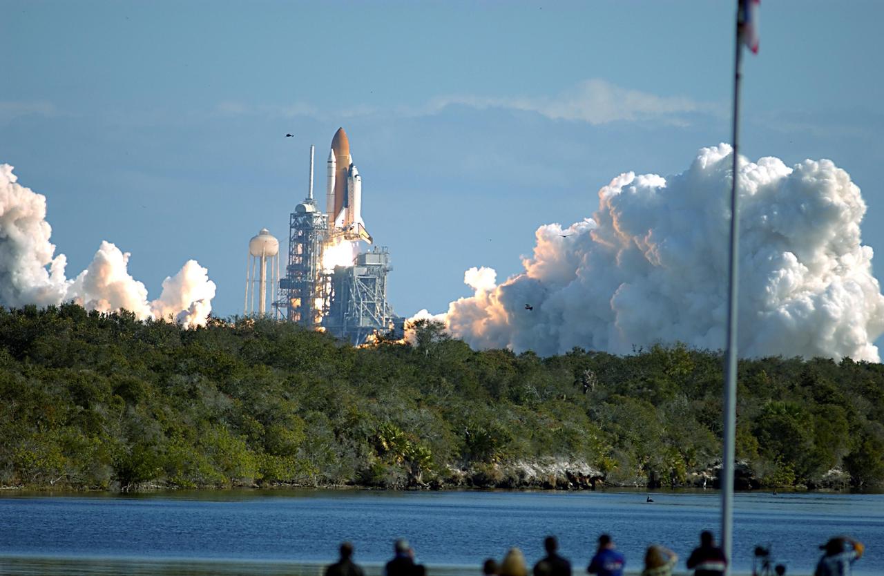 KENNEDY SPACE CENTER, FLA. --  Billows of white clouds of steam and smoke frame Space Shuttle Columbia as it rises above the launch tower on Launch Pad 39A on mission STS-107. Following a flawless and uneventful countdown, liftoff occurred on-time at 10:39 a.m. EST.  The 16-day research mission will include FREESTAR (Fast Reaction Experiments Enabling Science, Technology, Applications and Research) and the SHI Research Double Module (SHI/RDM), known as SPACEHAB.  Experiments on the module range from material sciences to life sciences. Landing is scheduled at about 8:53 a.m. EST on Saturday, Feb. 1.  This mission is the first Shuttle mission of 2003. Mission STS-107 is the 28th flight of the orbiter Columbia and the 113th flight overall in NASA's Space Shuttle program. 