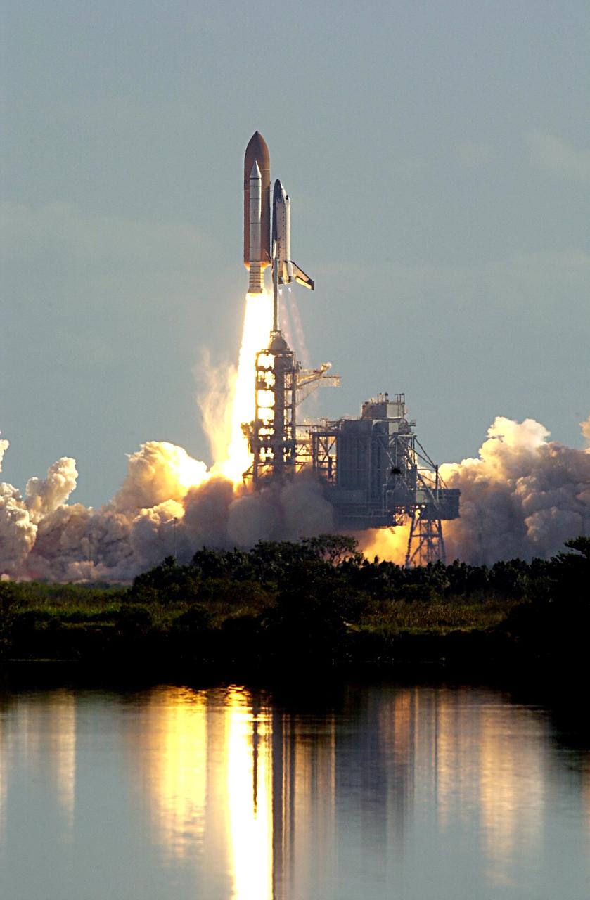 KENNEDY SPACE CENTER, FLA. --  As billows of smoke and steam roll across the landscape, the fiery launch of Space Shuttle Columbia on mission STS-107 is reflected in nearby water. Following a flawless and uneventful countdown, liftoff occurred on-time at 10:39 a.m. EST.  The 16-day research mission will include FREESTAR (Fast Reaction Experiments Enabling Science, Technology, Applications and Research) and the SHI Research Double Module (SHI/RDM), known as SPACEHAB.  Experiments on the module range from material sciences to life sciences. Landing is scheduled at about 8:53 a.m. EST on Saturday, Feb. 1.  This mission is the first Shuttle mission of 2003. Mission STS-107 is the 28th flight of the orbiter Columbia and the 113th flight overall in NASA's Space Shuttle program. 
