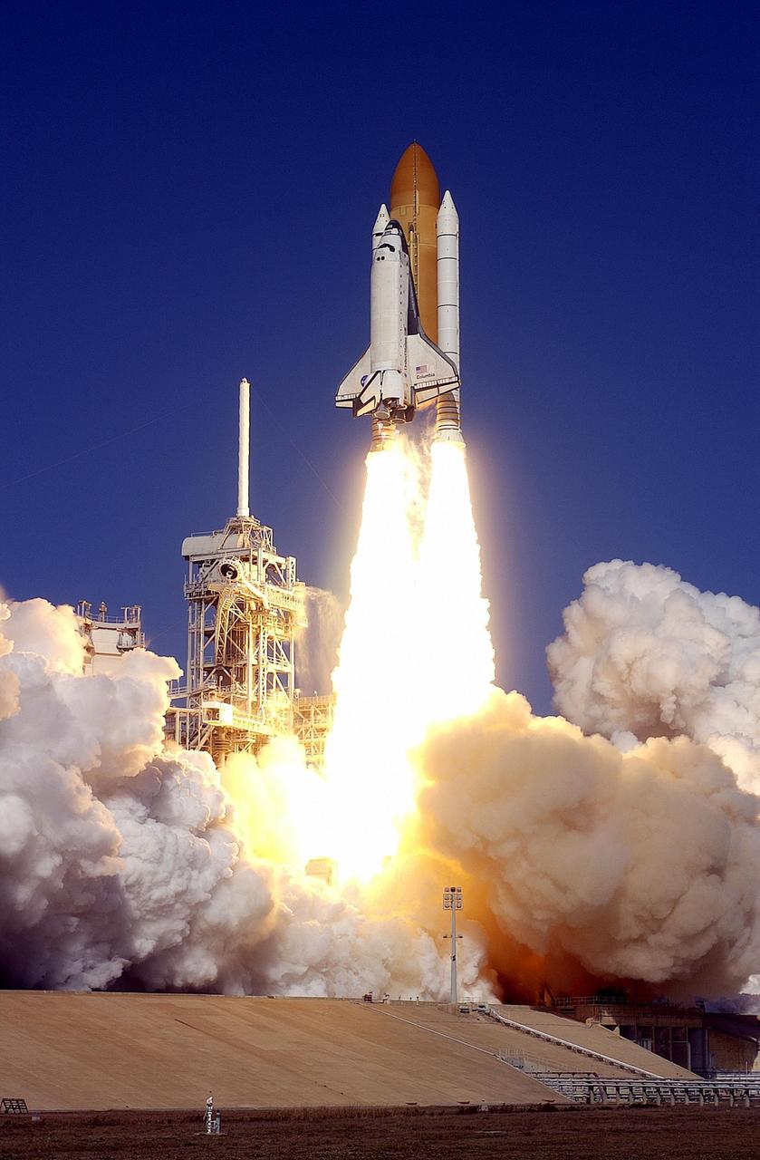 KENNEDY SPACE CENTER, FLA. -- Spewing flames and billowing clouds of smoke across Launch Pad 39A, Space Shuttle Columbia roars toward space on mission STS-107. Following a flawless and uneventful countdown, liftoff occurred on-time at 10:39 a.m. EST.  The 16-day research mission will include FREESTAR (Fast Reaction Experiments Enabling Science, Technology, Applications and Research) and the SHI Research Double Module (SHI/RDM), known as SPACEHAB.  Experiments on the module range from material sciences to life sciences..  Landing of Columbia is scheduled at about 8:53 a.m. EST on Saturday, Feb. 1.  This mission is the first Shuttle mission of 2003. Mission STS-107 is the 28th flight of the orbiter Columbia and the 113th flight overall in NASA's Space Shuttle program.  [Photo courtesy of Scott Andrews]
