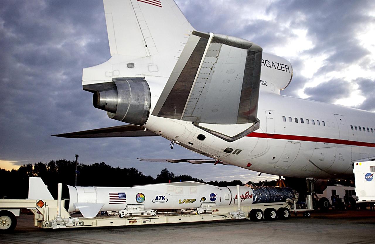 KENNEDY SPACE CENTER, FLA. - The Pegasus XL launch vehicle, with the Solar Radiation and Climate Experiment (SORCE) satellite aboard, is moved underneath the L-1011 aircraft that will carry the Pegasus to the launch altitude of 39,000 feet over the Atlantic Ocean approximately 100 miles east-southeast of Cape Canaveral. SORCE, built by Orbital Sciences Corporation, will study and measure solar irradiance as a source of energy in the Earth's atmosphere. The launch of SORCE is scheduled for Jan. 25 at 3:14 p.m. from CCAFS.