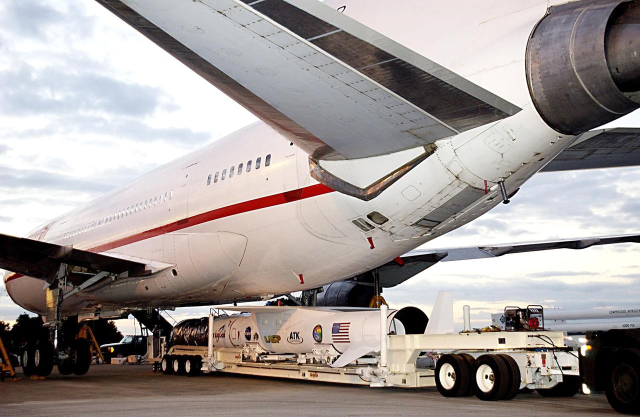 KENNEDY SPACE CENTER, FLA. - The Pegasus XL launch vehicle, with the Solar Radiation and Climate Experiment (SORCE) satellite aboard, is moved underneath the L-1011 aircraft that will carry the Pegasus to the launch altitude of 39,000 feet over the Atlantic Ocean approximately 100 miles east-southeast of Cape Canaveral. SORCE, built by Orbital Sciences Corporation, will study and measure solar irradiance as a source of energy in the Earth's atmosphere. The launch of SORCE is scheduled for Jan. 25 at 3:14 p.m. from CCAFS.