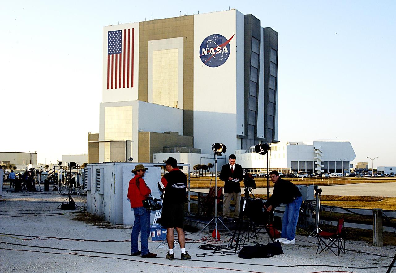 KENNEDY SPACE CENTER, FLA. - Media broadcast outside of the NASA News Center as they report the tragic loss of Space Shuttle Columbia as it was returning to Earth on mission STS-107.  