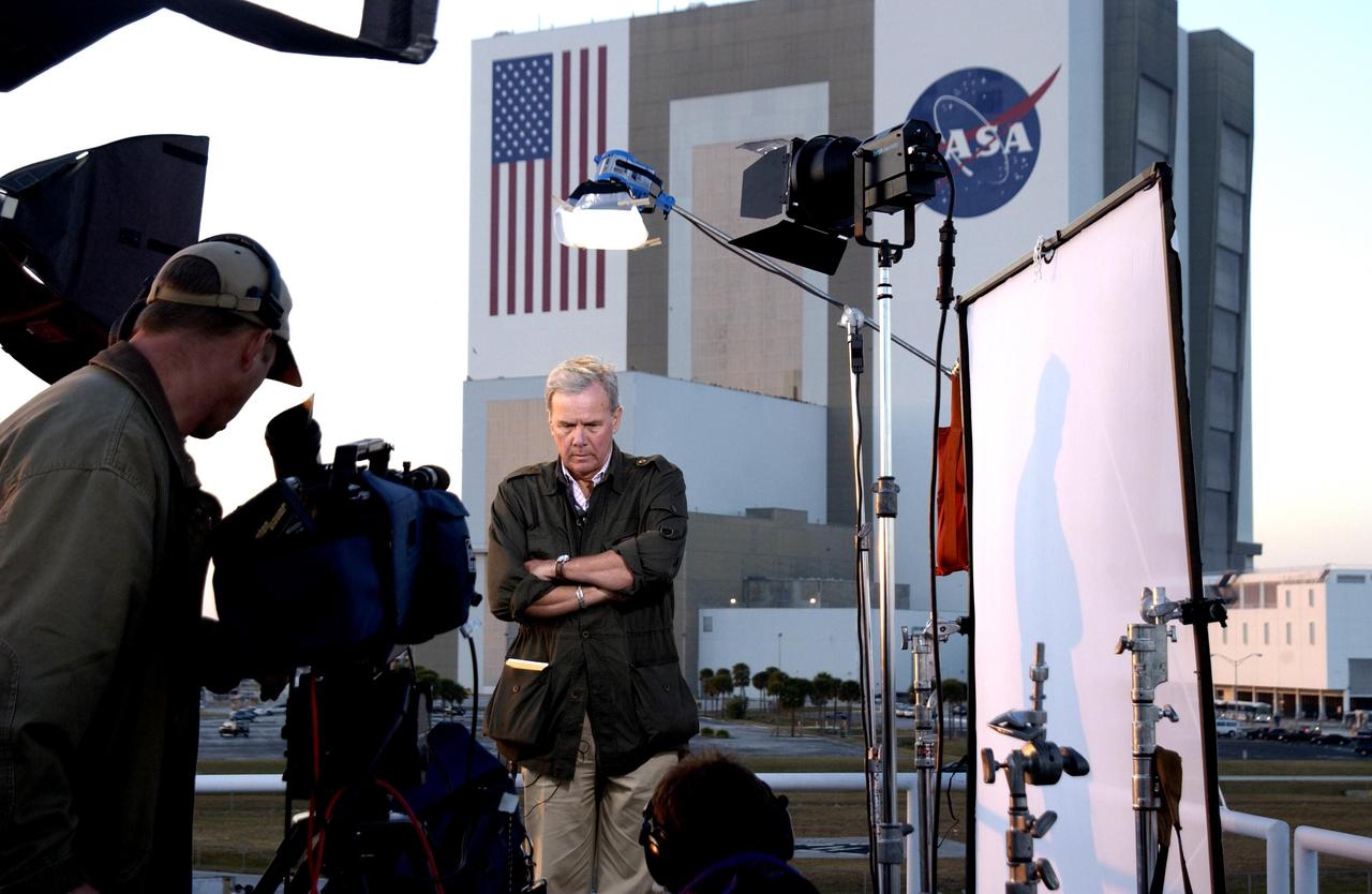 KENNEDY SPACE CENTER, FLA. -- On the top of the mound where the NASA News Center is located, NBC television news anchor Tom Brokaw gets ready to give a report on the tragic loss of Space Shuttle Columbia as it was returning to Earth on mission STS-107. Journalists from around the world covered the event.