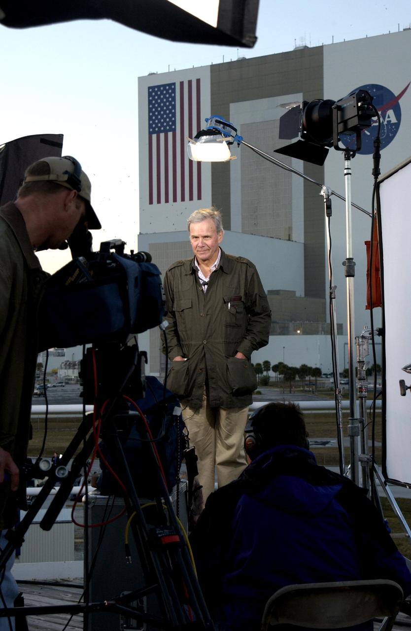 KENNEDY SPACE CENTER, FLA. -- On the top of the mound where the NASA News Center is located, NBC television news anchor Tom Brokaw reports on the tragic loss of Space Shuttle Columbia as it was returning to Earth on mission STS-107. Journalists from around the world covered the event.