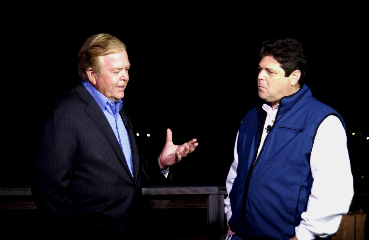 KENNEDY SPACE CENTER, FLA. - CNN anchor Lou Dobbs and reporter John Zarella talk on camera while covering the tragic loss of Space Shuttle Columbia as it was returning to Earth on mission STS-107. Journalists from around the world covered the event.   