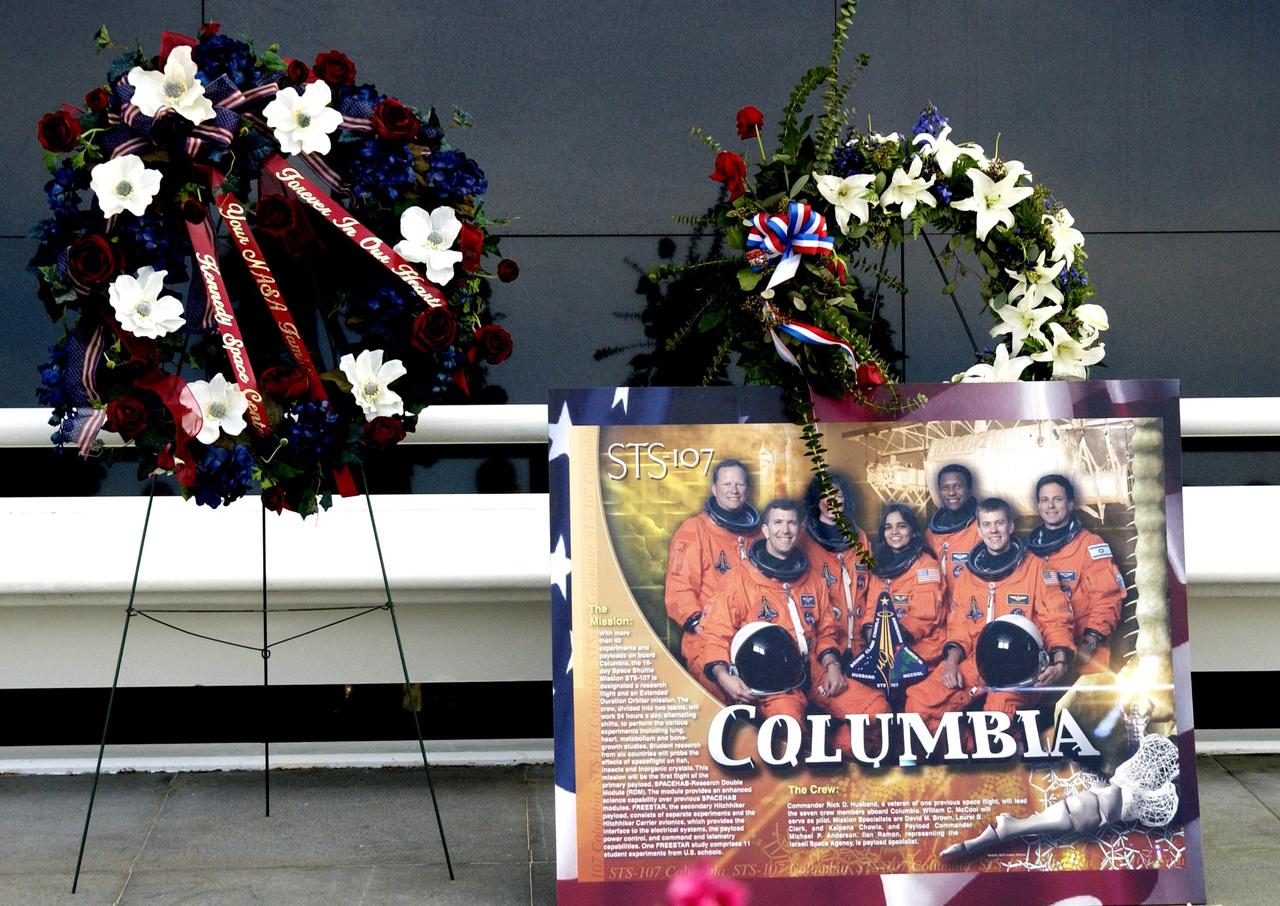 KENNEDY SPACE CENTER, FLA. --  Among the many floral tributes to honor the fallen crew of Columbia is this wreath, presented by Center Director Roy Bridges and Deputy Director James Kennedy.  The site is the Astronauts Memorial Space Mirror at the KSC Visitor Complex. The mirror is a national tribute to the earlier 17 American astronauts who also gave their lives to the quest to explore space.    .  