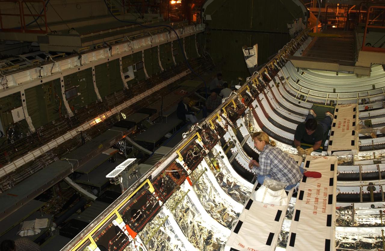 KENNEDY SPACE CENTER, FLA. -- United Space Alliance (USA) technicians continue processing of Space Shuttle Discovery.  Discovery is undergoing its Orbiter Major Modification Period, a regularly scheduled structural inspection and modification downtime, which began in September 2002.        .  