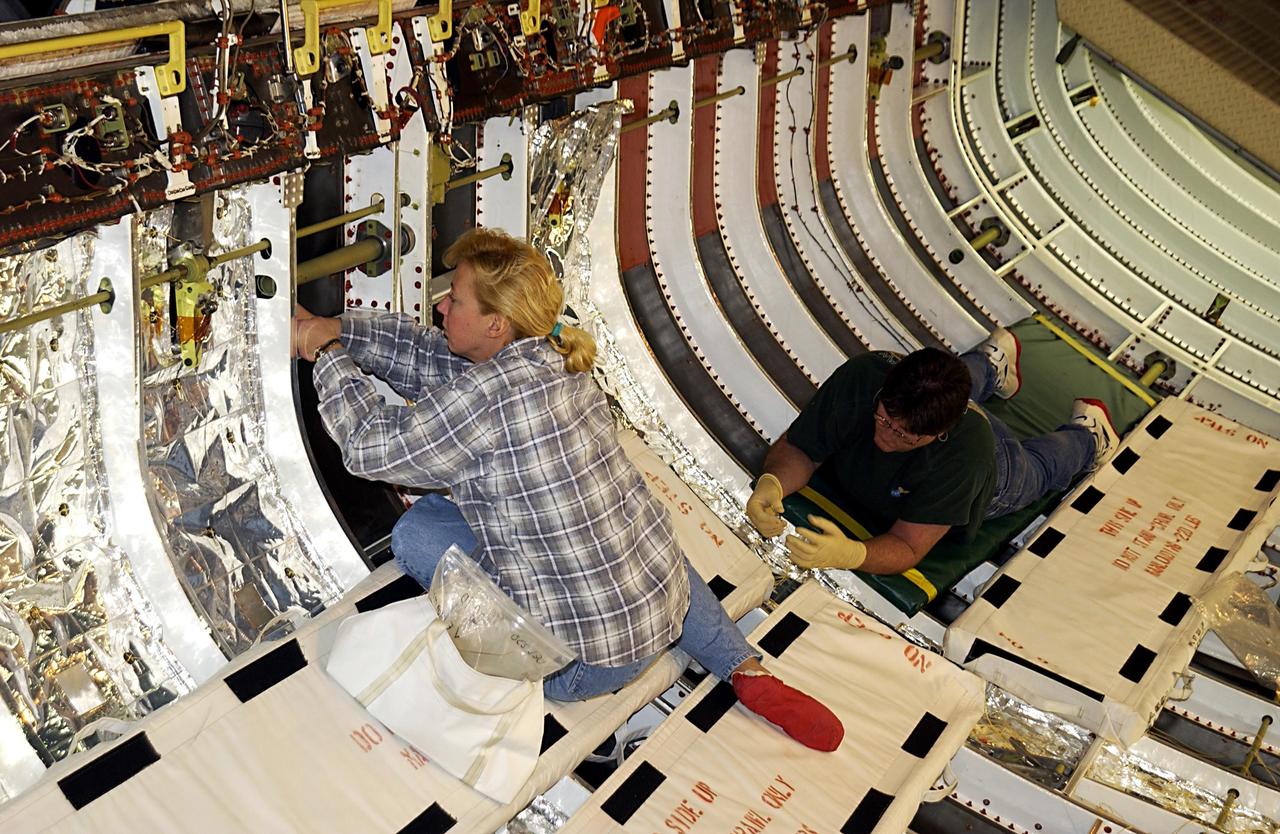 KENNEDY SPACE CENTER, FLA. -- United Space Alliance (USA) technicians continue processing of Space Shuttle Discovery.  Discovery is undergoing its Orbiter Major Modification Period, a regularly scheduled structural inspection and modification downtime, which began in September 2002.        .  