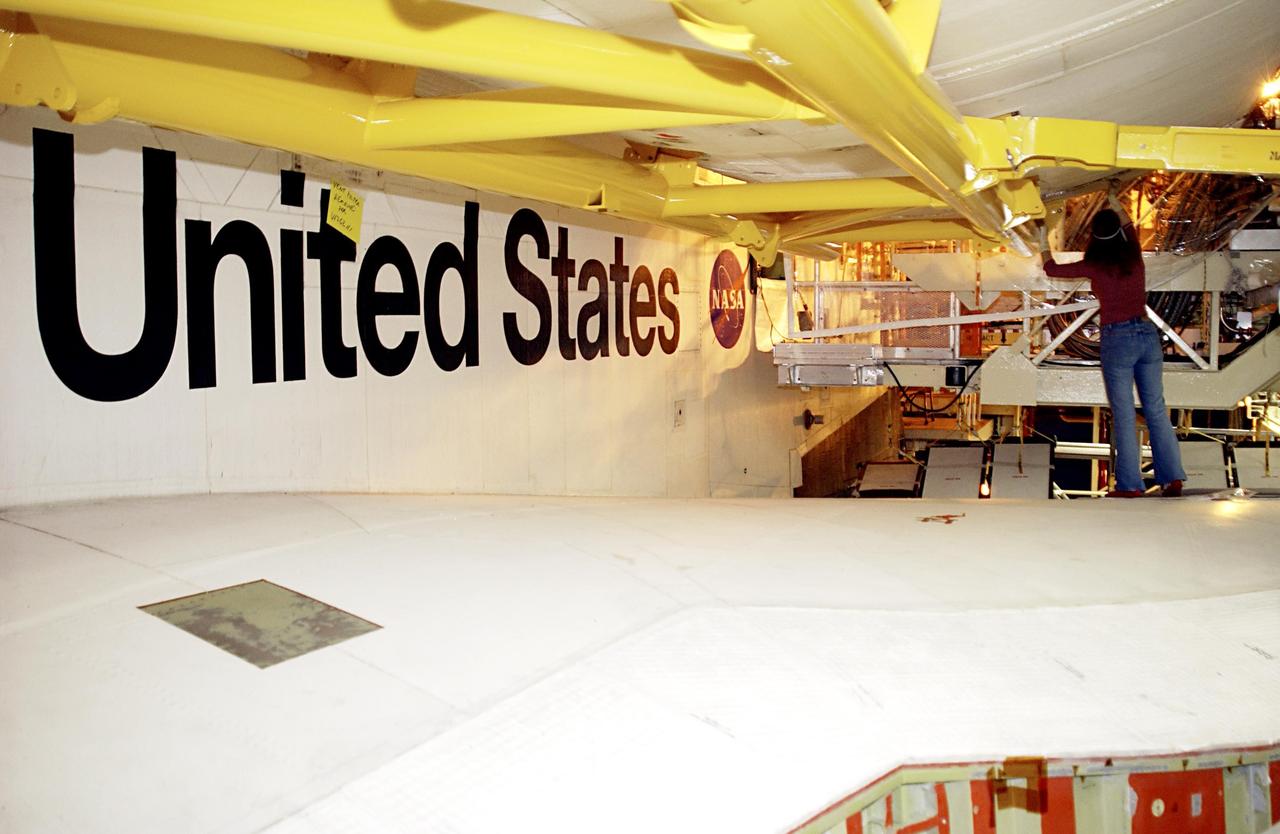 KENNEDY SPACE CENTER, FLA. --A United Space Alliance (USA) technician continues processing of Space Shuttle Discovery.  Discovery is undergoing its Orbiter Major Modification Period, a regularly scheduled structural inspection and modification downtime, which began in September 2002.        .  