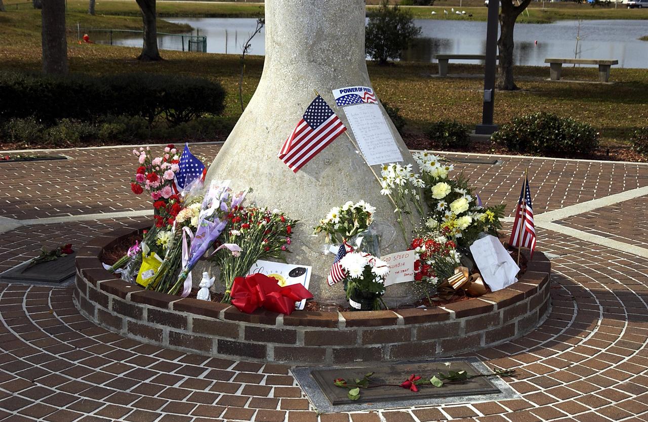 KENNEDY SPACE CENTER, FLA. -  At a site in the KSC Visitor Complex, flowers and mementos are left by guests as a memorial tribute to the fallen crew of Columbia.  The Columbia and her crew of seven were lost on Feb. 1, 2003, over East Texas as they returned to Earth after a 16-day research mission, STS-107.