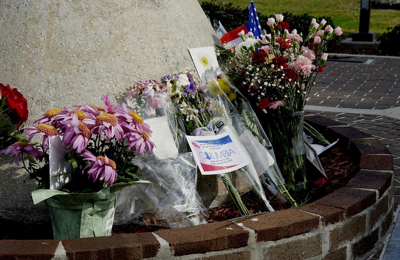 KENNEDY SPACE CENTER, FLA. -  At a site in the KSC Visitor Complex, flowers are left by guests as a memorial tribute to the fallen crew of Columbia.  The Columbia and her crew of seven were lost on Feb. 1, 2003, over East Texas as they returned to Earth after a 16-day research mission, STS-107.