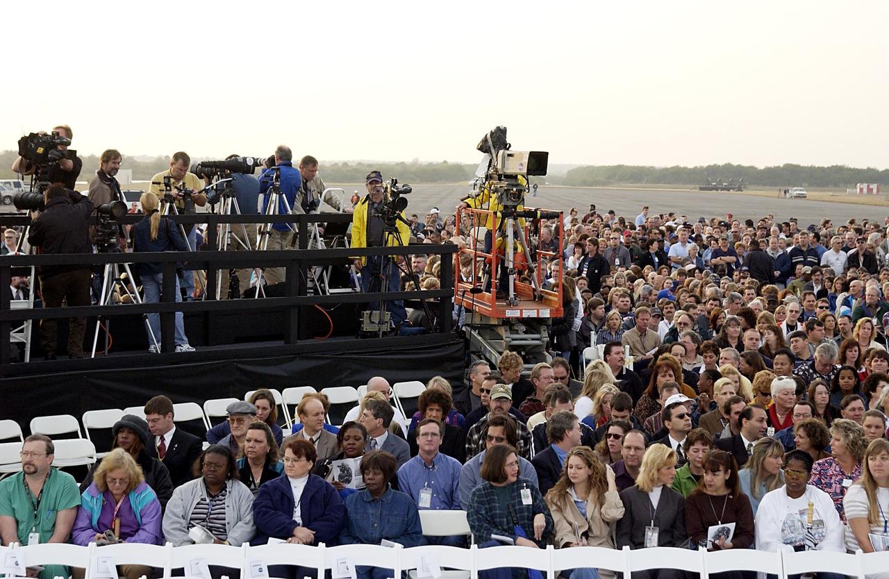 KENNEDY SPACE CENTER, FLA. -  A Columbia Crew Memorial Service is held at the Shuttle Landing Facility for KSC employees and invited guests.  The Columbia and her crew of seven were lost on Feb. 1, 2003, over East Texas as they returned to Earth after a 16-day research mission.  Taking part in the service were NASA Administrator Sean O’Keefe, former KSC Director Robert Crippen, astronaut Jim Halsell, several employees, area clergymen, and members of Patrick Air Force Base.  The service concluded with a “Missing Man Formation Fly Over” by NASA T-38 jet aircraft.