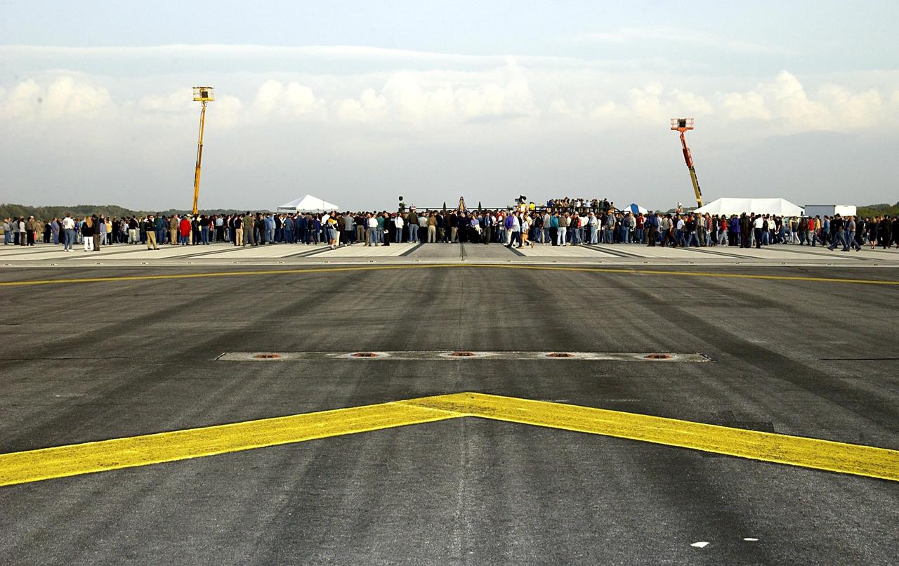 KENNEDY SPACE CENTER, FLA. -  A Columbia Crew Memorial Service is held at the Shuttle Landing Facility for KSC employees and invited guests.  The Columbia and her crew of seven were lost on Feb. 1, 2003, over East Texas as they returned to Earth after a 16-day research mission.  Taking part in the service were NASA Administrator Sean O’Keefe, former KSC Director Robert Crippen, astronaut Jim Halsell, several employees, area clergymen, and members of Patrick Air Force Base.  The service concluded with a “Missing Man Formation Fly Over” by NASA T-38 jet aircraft.