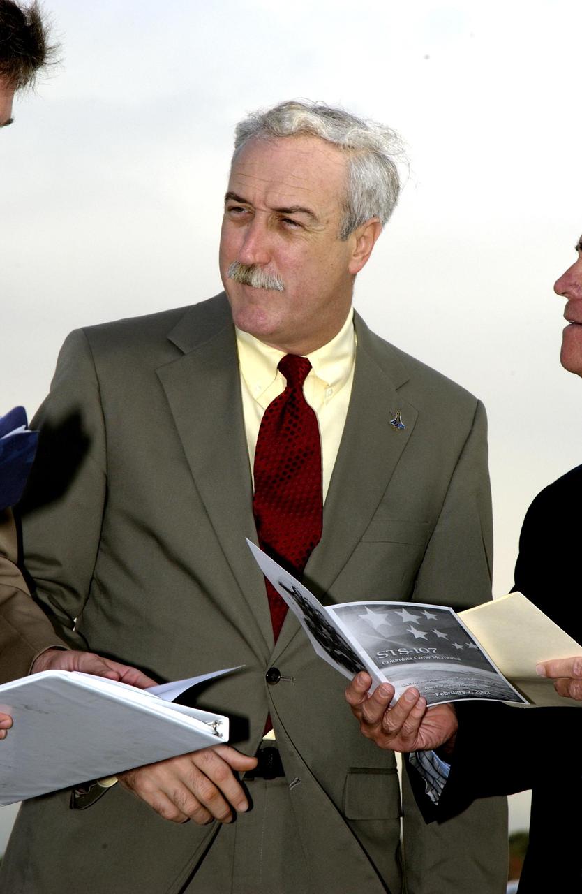 KENNEDY SPACE CENTER, FLA. -  A Columbia Crew Memorial Service is held at the Shuttle Landing Facility for KSC employees and invited guests, including NASA Administrator Sean O'Keefe. The Columbia and her crew of seven were lost on Feb. 1, 2003, over East Texas as they returned to Earth after a 16-day research mission.  Taking part in the service were NASA Administrator Sean O’Keefe, former KSC Director Robert Crippen, astronaut Jim Halsell, several employees, area clergymen, and members of Patrick Air Force Base.  The service concluded with a “Missing Man Formation Fly Over” by NASA T-38 jet aircraft.