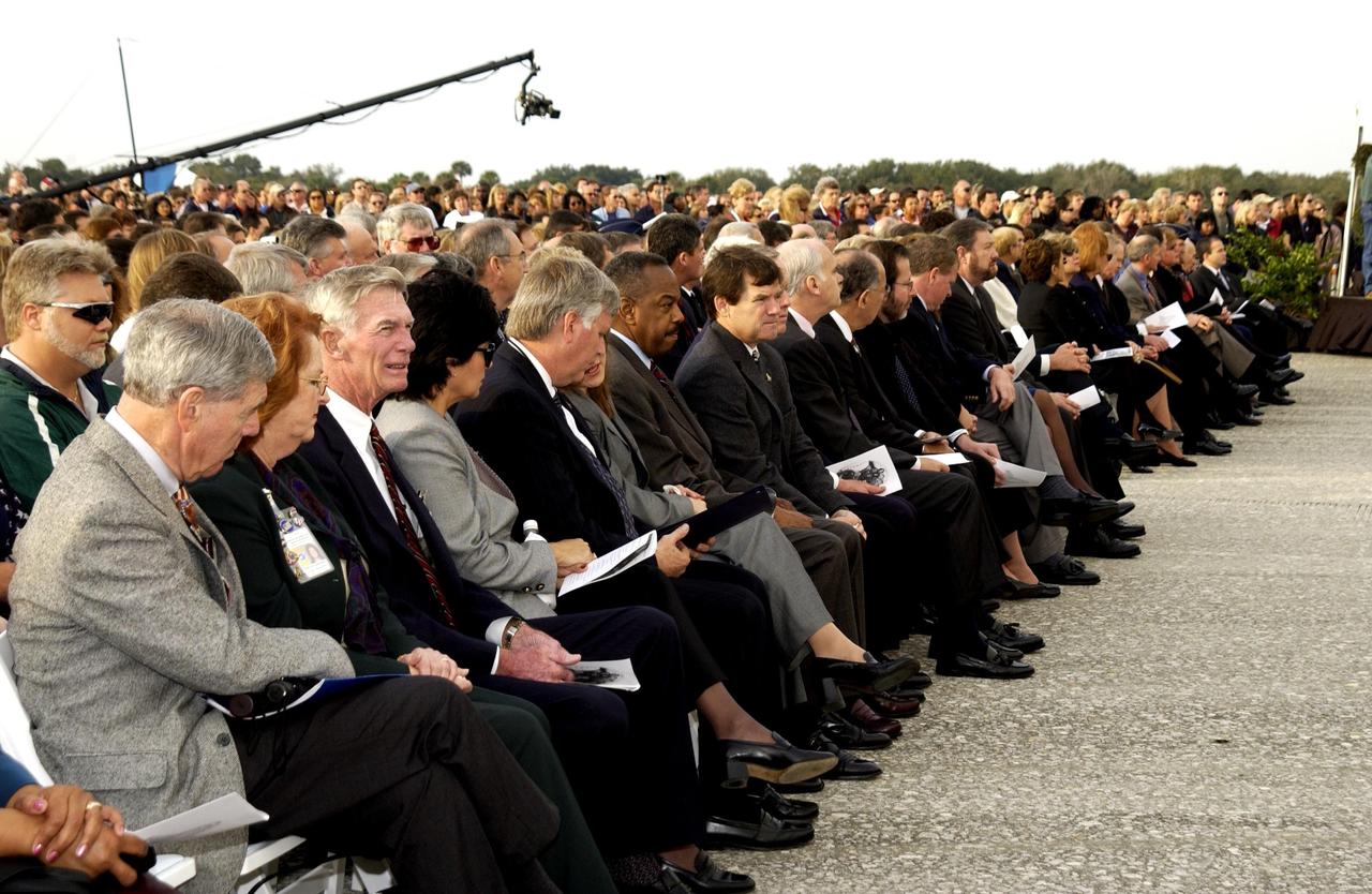 KENNEDY SPACE CENTER, FLA. -  A Columbia Crew Memorial Service is held at the Shuttle Landing Facility for KSC employees and invited guests. The Columbia and her crew of seven were lost on Feb. 1, 2003, over East Texas as they returned to Earth after a 16-day research mission.  Taking part in the service were NASA Administrator Sean O’Keefe, former KSC Director Robert Crippen, astronaut Jim Halsell, several employees, area clergymen, and members of Patrick Air Force Base.  The service concluded with a “Missing Man Formation Fly Over” by NASA T-38 jet aircraft.