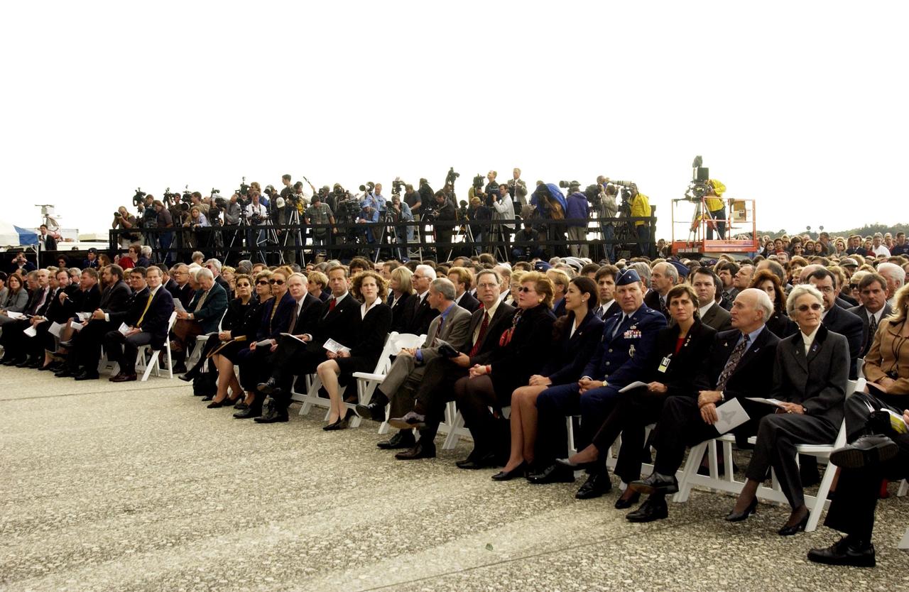 KENNEDY SPACE CENTER, FLA. -  A Columbia Crew Memorial Service is held at the Shuttle Landing Facility for KSC employees and invited guests. The Columbia and her crew of seven were lost on Feb. 1, 2003, over East Texas as they returned to Earth after a 16-day research mission.  Taking part in the service were NASA Administrator Sean O’Keefe, former KSC Director Robert Crippen, astronaut Jim Halsell, several employees, area clergymen, and members of Patrick Air Force Base.  The service concluded with a “Missing Man Formation Fly Over” by NASA T-38 jet aircraft.