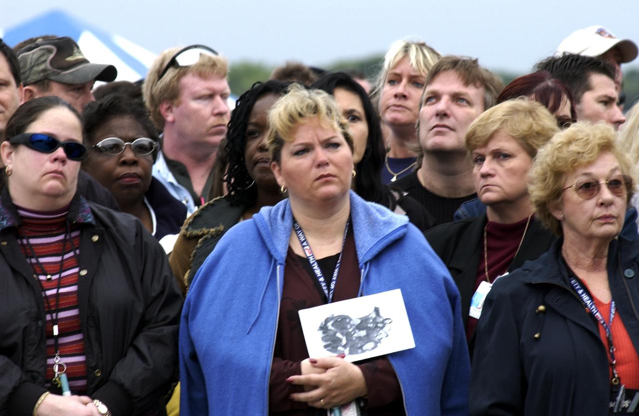 KENNEDY SPACE CENTER, FLA. -  A Columbia Crew Memorial Service is held at the Shuttle Landing Facility for KSC employees and invited guests. The Columbia and her crew of seven were lost on Feb. 1, 2003, over East Texas as they returned to Earth after a 16-day research mission.  Taking part in the service were NASA Administrator Sean O’Keefe, former KSC Director Robert Crippen, astronaut Jim Halsell, several employees, area clergymen, and members of Patrick Air Force Base.  The service concluded with a “Missing Man Formation Fly Over” by NASA T-38 jet aircraft.
