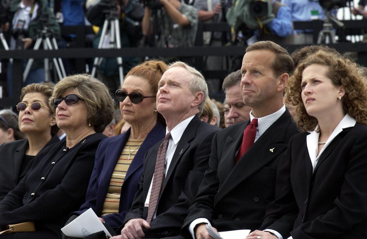 KENNEDY SPACE CENTER, FLA. -  A Columbia Crew Memorial Service is held at the Shuttle Landing Facility for KSC employees and invited guests. KSC Director and former astronaut Roy D. Bridges, Jr., is seated third from right.  The Columbia and her crew of seven were lost on Feb. 1, 2003, over East Texas as they returned to Earth after a 16-day research mission.  Taking part in the service were NASA Administrator Sean O’Keefe, former KSC Director Robert Crippen, astronaut Jim Halsell, several employees, area clergymen, and members of Patrick Air Force Base.  The service concluded with a “Missing Man Formation Fly Over” by NASA T-38 jet aircraft.