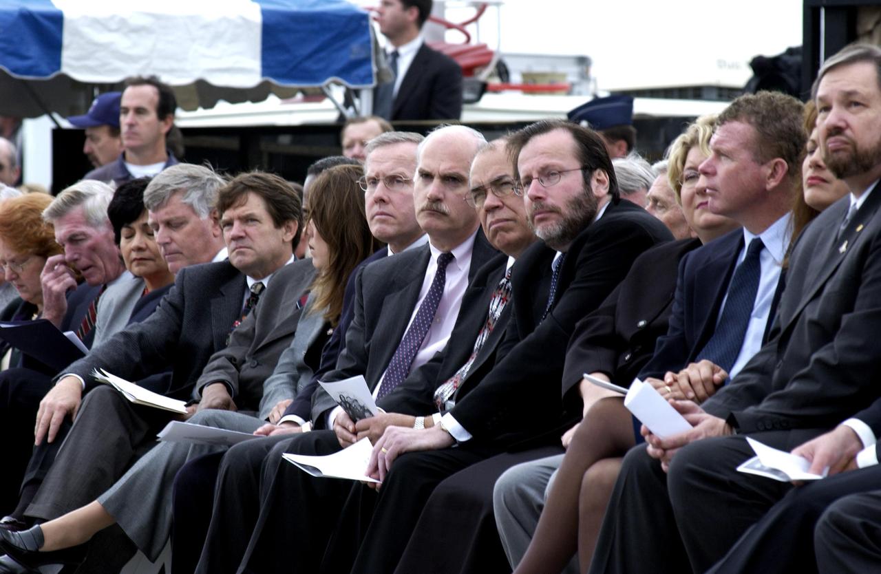 KENNEDY SPACE CENTER, FLA. -  A Columbia Crew Memorial Service is held at the Shuttle Landing Facility for KSC employees and invited guests.  The Columbia and her crew of seven were lost on Feb. 1, 2003, over East Texas as they returned to Earth after a 16-day research mission.  Taking part in the service were NASA Administrator Sean O’Keefe, former KSC Director Robert Crippen, astronaut Jim Halsell, several employees, area clergymen, and members of Patrick Air Force Base.  The service concluded with a “Missing Man Formation Fly Over” by NASA T-38 jet aircraft.