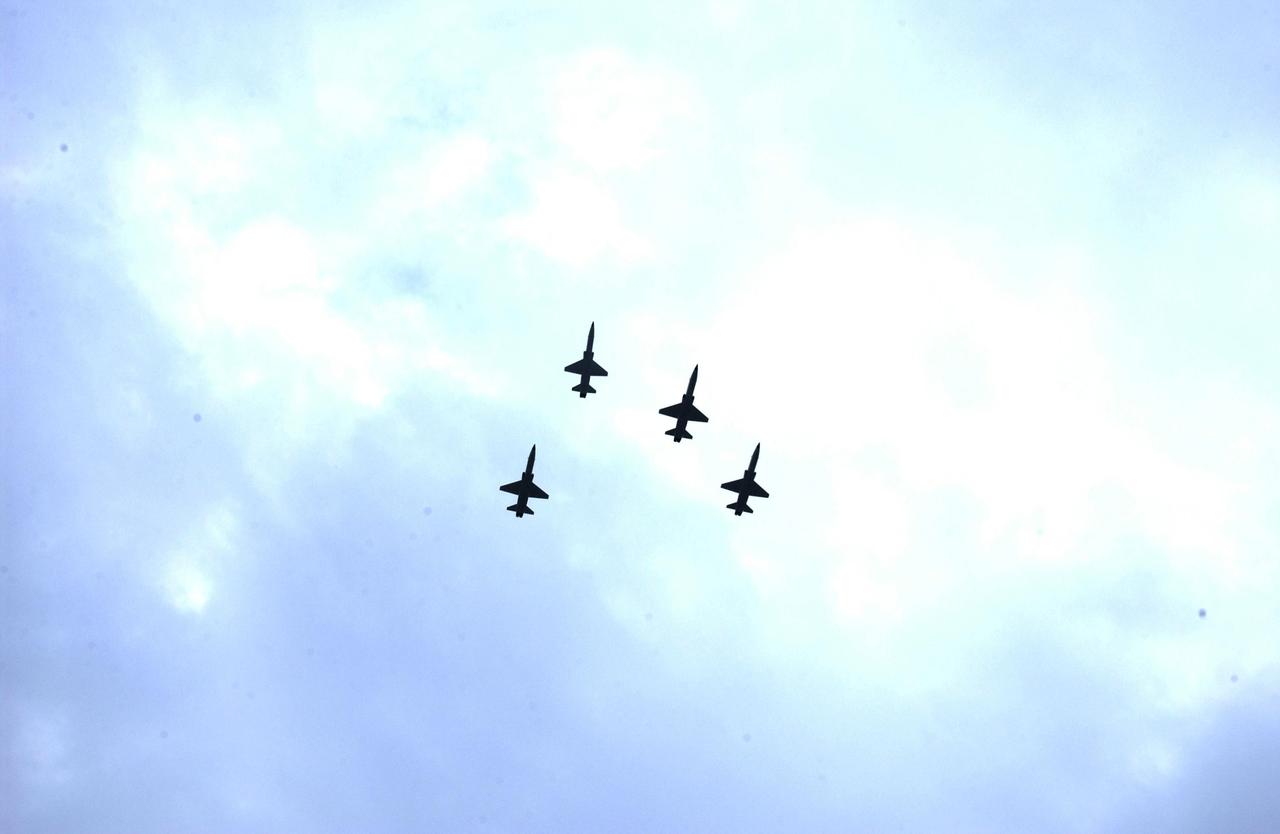 KENNEDY SPACE CENTER, FLA. -  A Columbia Crew Memorial Service is held at the Shuttle Landing Facility for KSC employees and invited guests.  The service concluded with a “Missing Man Formation Fly Over” by NASA T-38 jet aircraft, seen here.  The Columbia and her crew of seven were lost on Feb. 1, 2003, over East Texas as they returned to Earth after a 16-day research mission.  Taking part in the service were NASA Administrator Sean O’Keefe, former KSC Director Robert Crippen, astronaut Jim Halsell, several employees, area clergymen, and members of Patrick Air Force Base.  