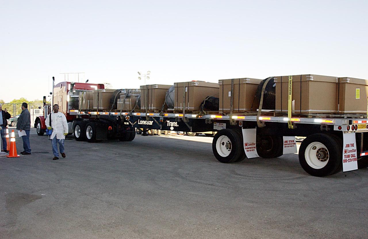KENNEDY SPACE CENTER, FLA. -- A truckload of recovered Columbia debris arrives at the RLV Hangar near the Shuttle Landing Facility. It was transported from the collection point at Barksdale Air Force Base, Shreveport, La. Workers in the RLV will attempt to reconstruct the orbiter as part of the ongoing investigation of the accident that destroyed the Columbia and claimed the lives of seven astronauts as they returned to Earth after a 16-day research mission, STS-107.