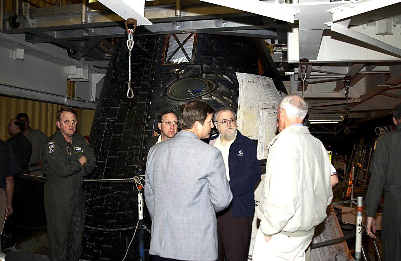 KENNEDY SPACE CENTER, FLA. --  Members of the Columbia Accident Board look over Space Shuttle Atlantis in the Vehicle Assembly Building.   At right is Retired Navy Admiral Harold W. Gehman Jr., chairman of the board.   The board is visiting sites at KSC to become familiar with the Shuttle launch process and elements. The independent board is charged with determining what caused the destruction of the Space Shuttle Columbia and the loss of its seven-member crew on Feb. 1 during reentry.