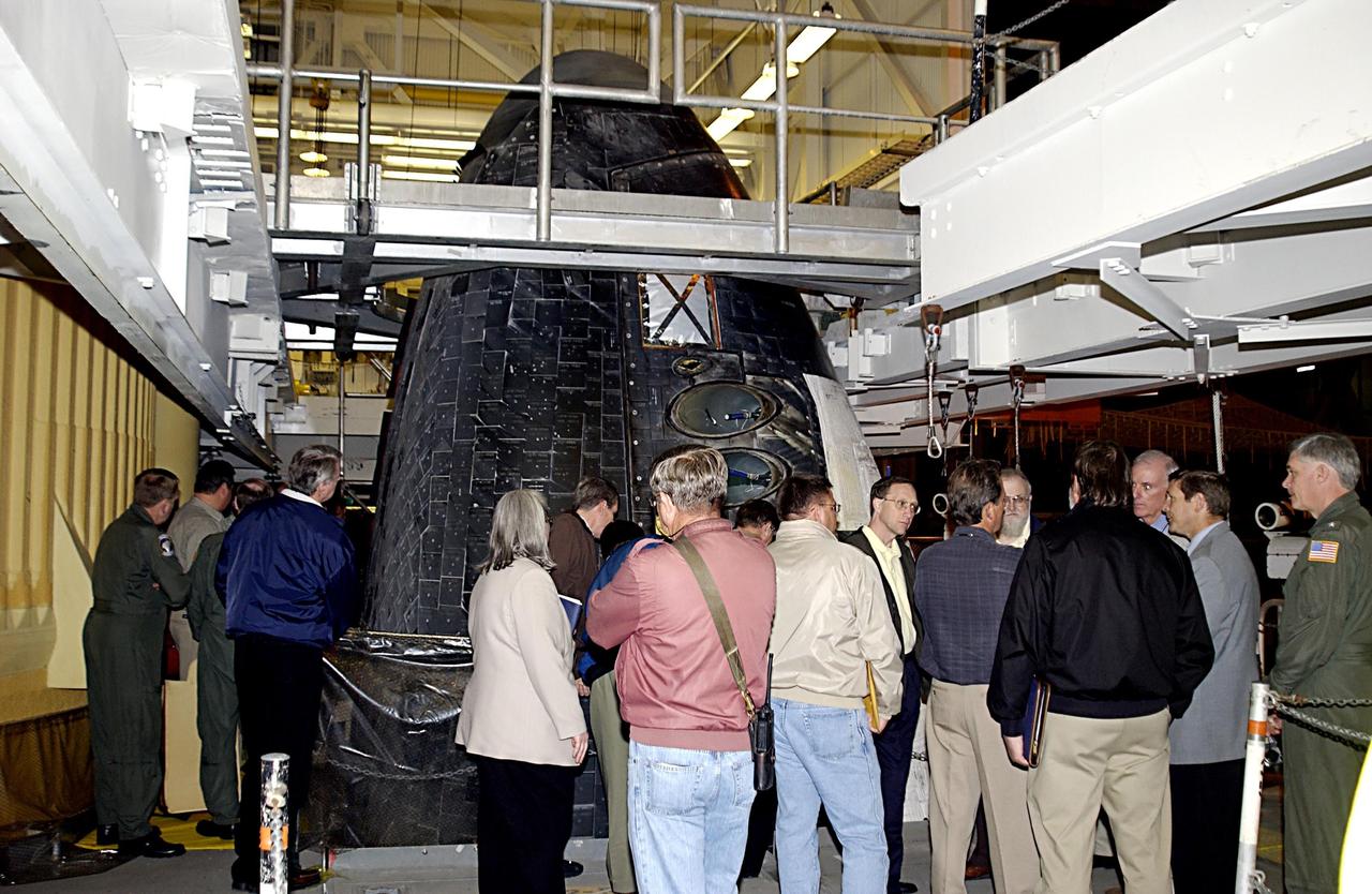 KENNEDY SPACE CENTER, FLA. -- Members of the Columbia Accident Investigation Board look over Space Shuttle Atlantis in the Vehicle Assembly Building.  The board is visiting sites at KSC to become familiar with the Shuttle launch process and elements. The independent board is charged with determining what caused the destruction of the Space Shuttle Columbia and the loss of its seven-member crew on Feb. 1 during reentry.