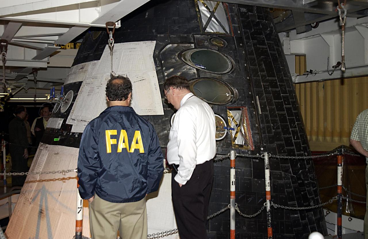 KENNEDY SPACE CENTER, FLA. -- Members of the Columbia Accident Investigation Board look over the nose of Space Shuttle Atlantis in the Vehicle Assembly Building.  The board is visiting sites at KSC to become familiar with the Shuttle launch process and elements.  They are standing in front of the nose of Space Shuttle Atlantis in the Vehicle Assembly Building. The independent board is charged with determining what caused the destruction of the Space Shuttle Columbia and the loss of its seven-member crew on Feb. 1 during reentry.