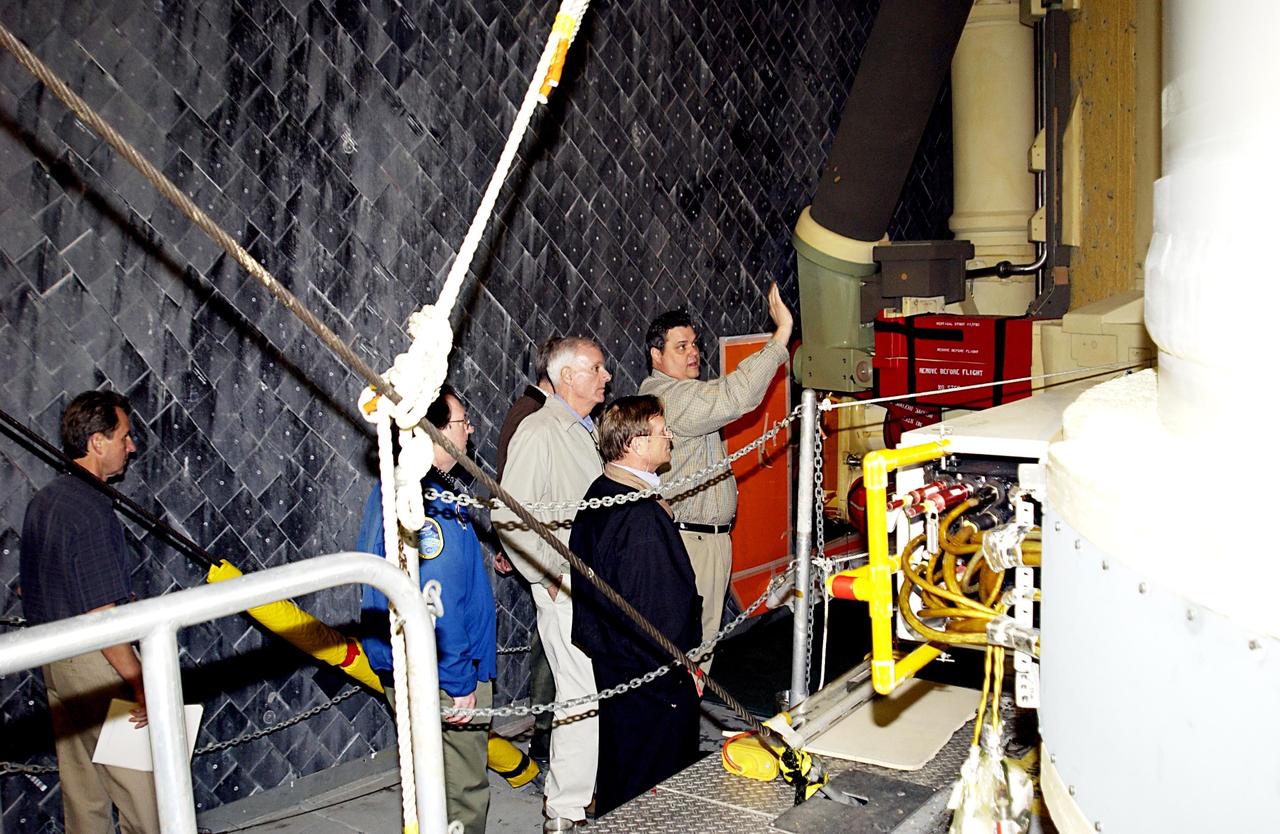 KENNEDY SPACE CENTER, FLA. --  Members of the Columbia Accident Investigation Board are in the Vehicle Assembly Building to look over Space Shuttle Atlantis (behind them). The board is visiting sites at KSC to become familiar with the Shuttle launch process and elements. The independent board is charged with determining what caused the destruction of the Space Shuttle Columbia and the loss of its seven-member crew on Feb. 1 during reentry.