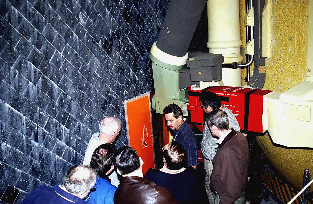 KENNEDY SPACE CENTER, FLA. --   Members of the Columbia Accident Investigation Board look at areas of interest on Space Shuttle Atlantis. The board is visiting sites at KSC to become familiar with the Shuttle launch process and elements. The independent board is charged with determining what caused the destruction of the Space Shuttle Columbia and the loss of its seven-member crew on Feb. 1 during reentry.