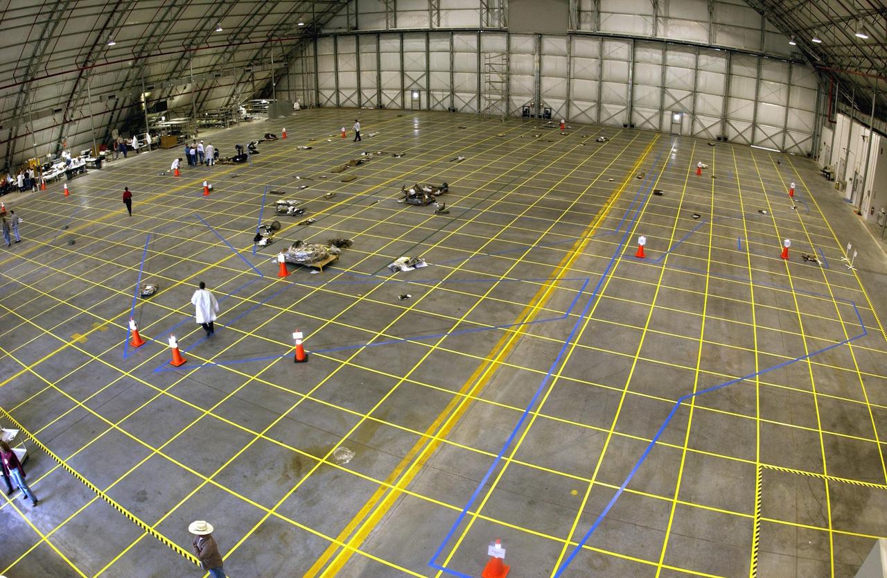 KENNEDY SPACE CENTER, FLA. -- The grid on which the pieces of Columbia debris will be organized is captured in this aerial view of the RLV Hangar floor. The debris has begun arriving at KSC from the collection point at Barksdale Air Force Base, Shreveport, La. As part of the ongoing investigation into the tragic accident that claimed Columbia and her crew of seven, workers will attempt to reconstruct the orbiter inside the hangar.