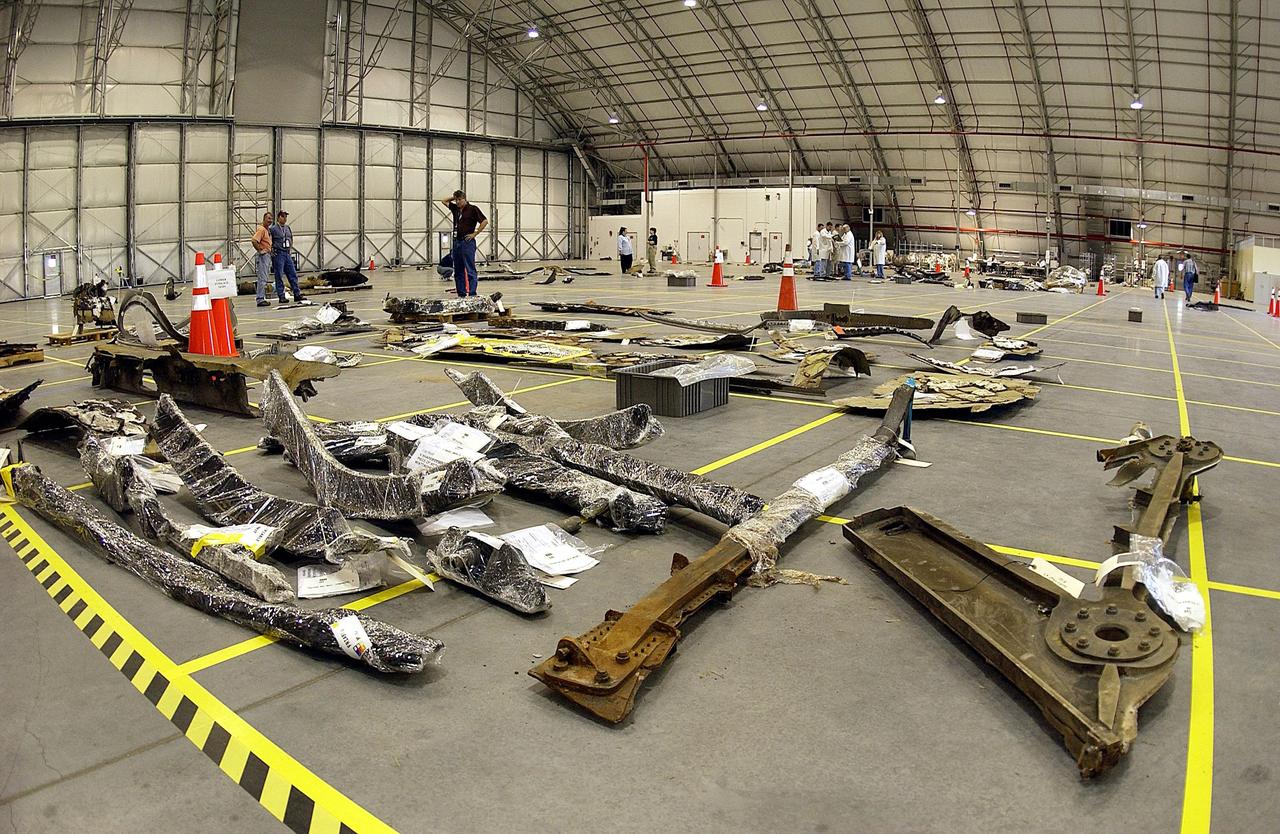 KENNEDY SPACE CENTER, FLA. -- The layout of the debris from the Space Shuttle Columbia is captured in this wide-angle view of a section of the RLV Hangar floor. The debris is being shipped to KSC from the collection point at Barksdale Air Force Base, Shreveport, La. As part of the ongoing investigation into the tragic accident that claimed Columbia and her crew of seven, workers will attempt to reconstruct the orbiter inside the hangar.